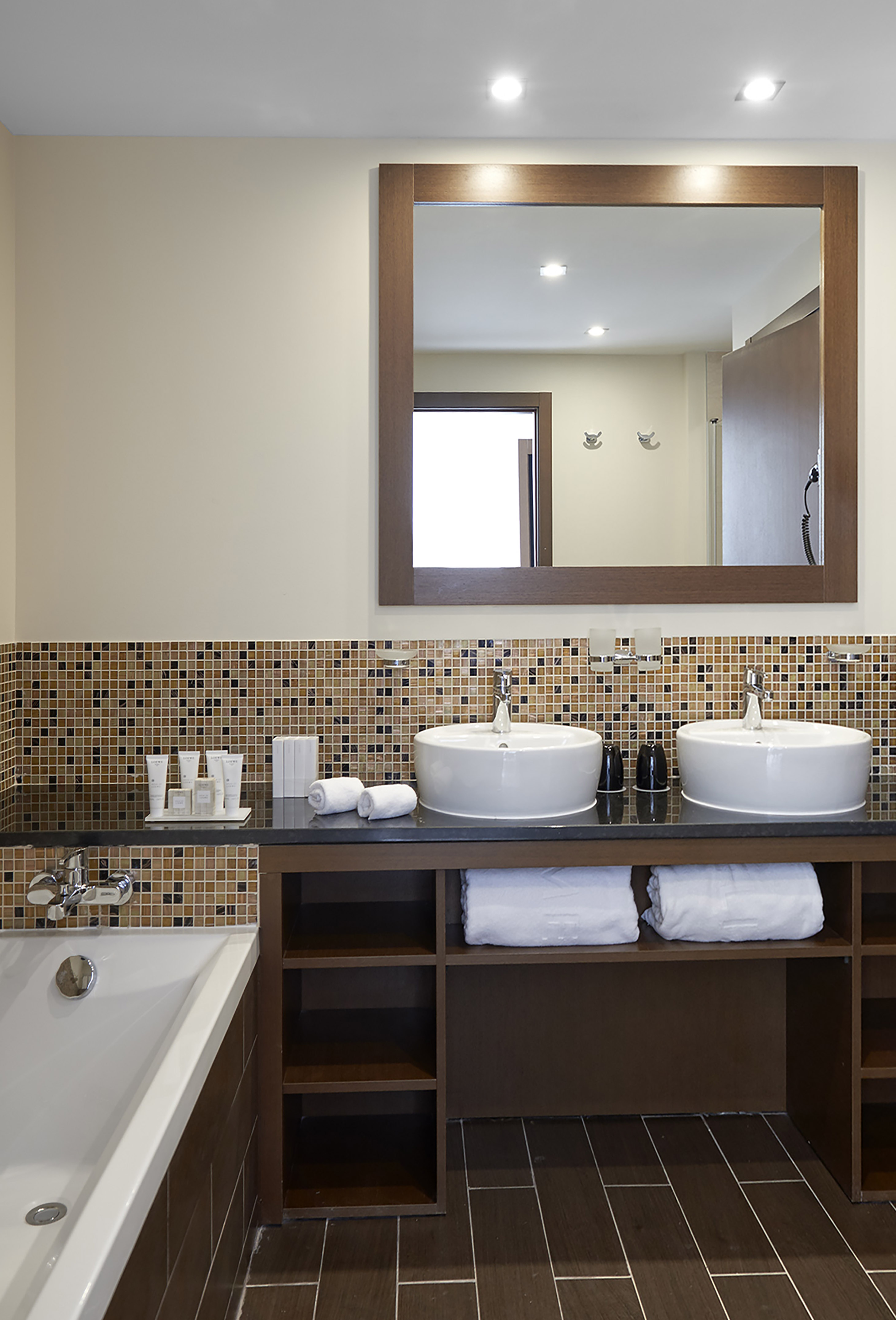a bathroom with a mirror and sinks