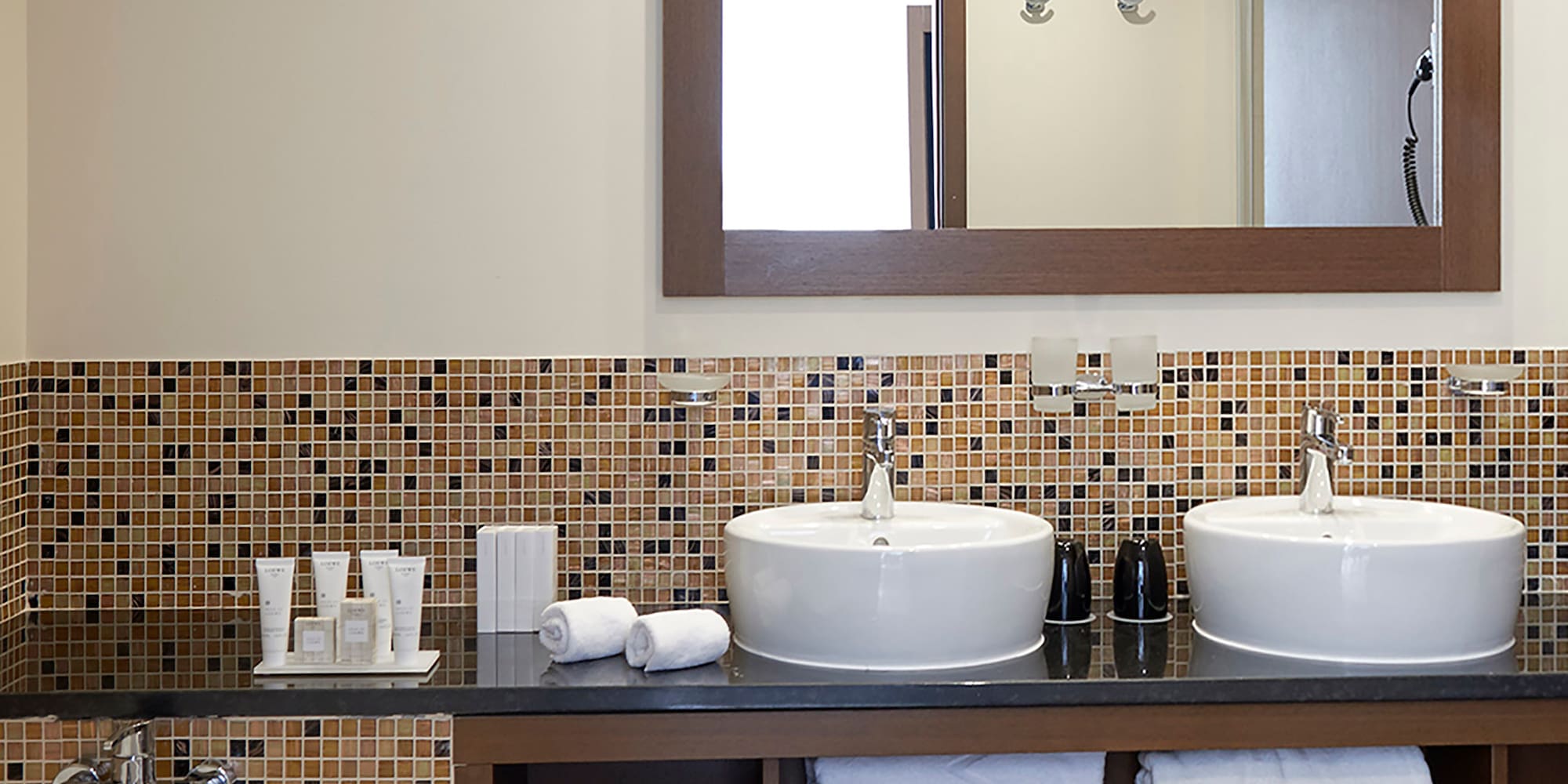 a bathroom with a mirror and sinks