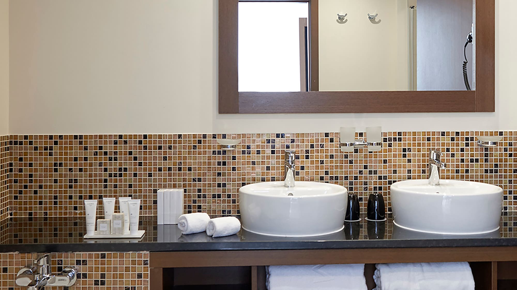 a bathroom with a mirror and sinks