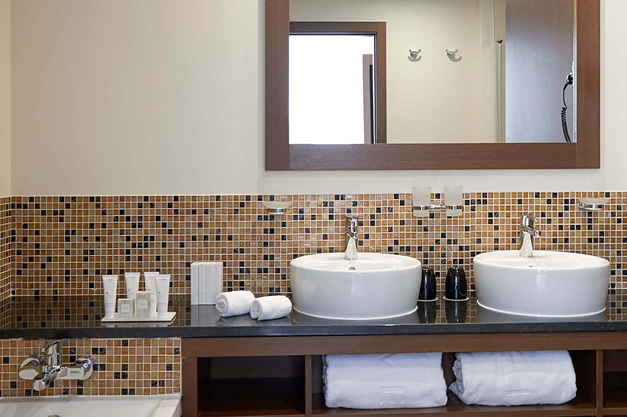a bathroom with a mirror and sinks