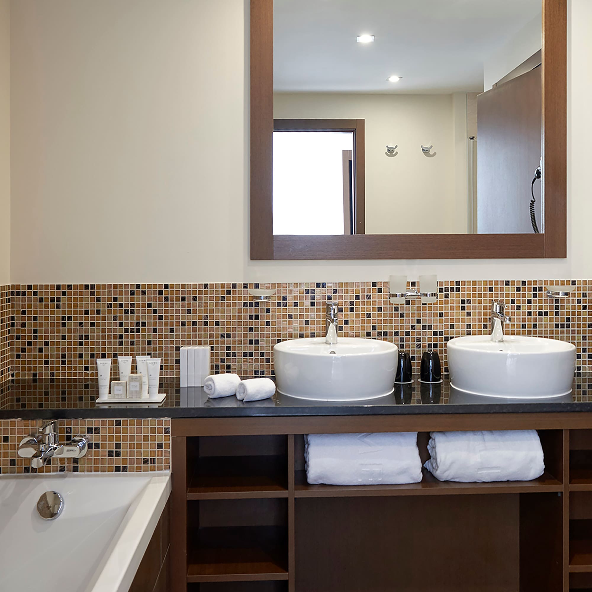 a bathroom with a mirror and sinks