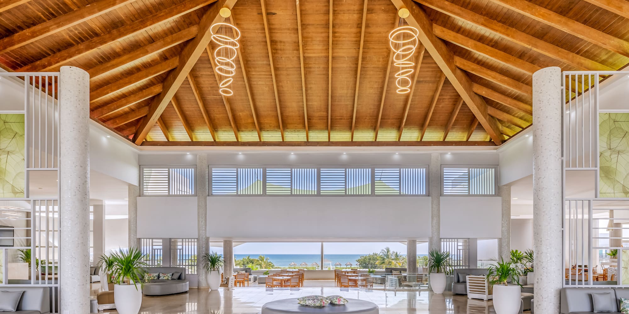 a large room with a large round table and chairs