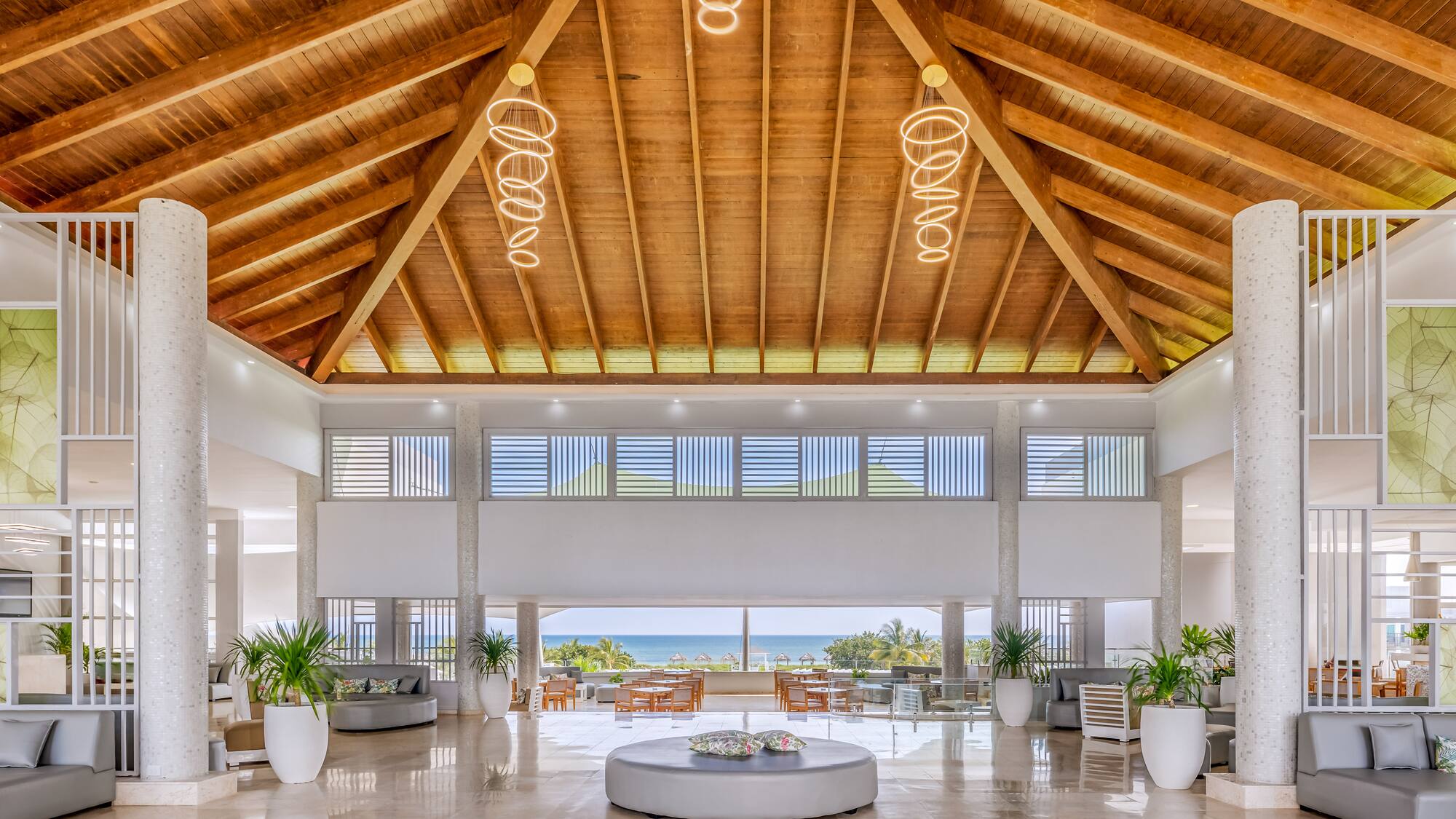 a large room with a large round table and chairs