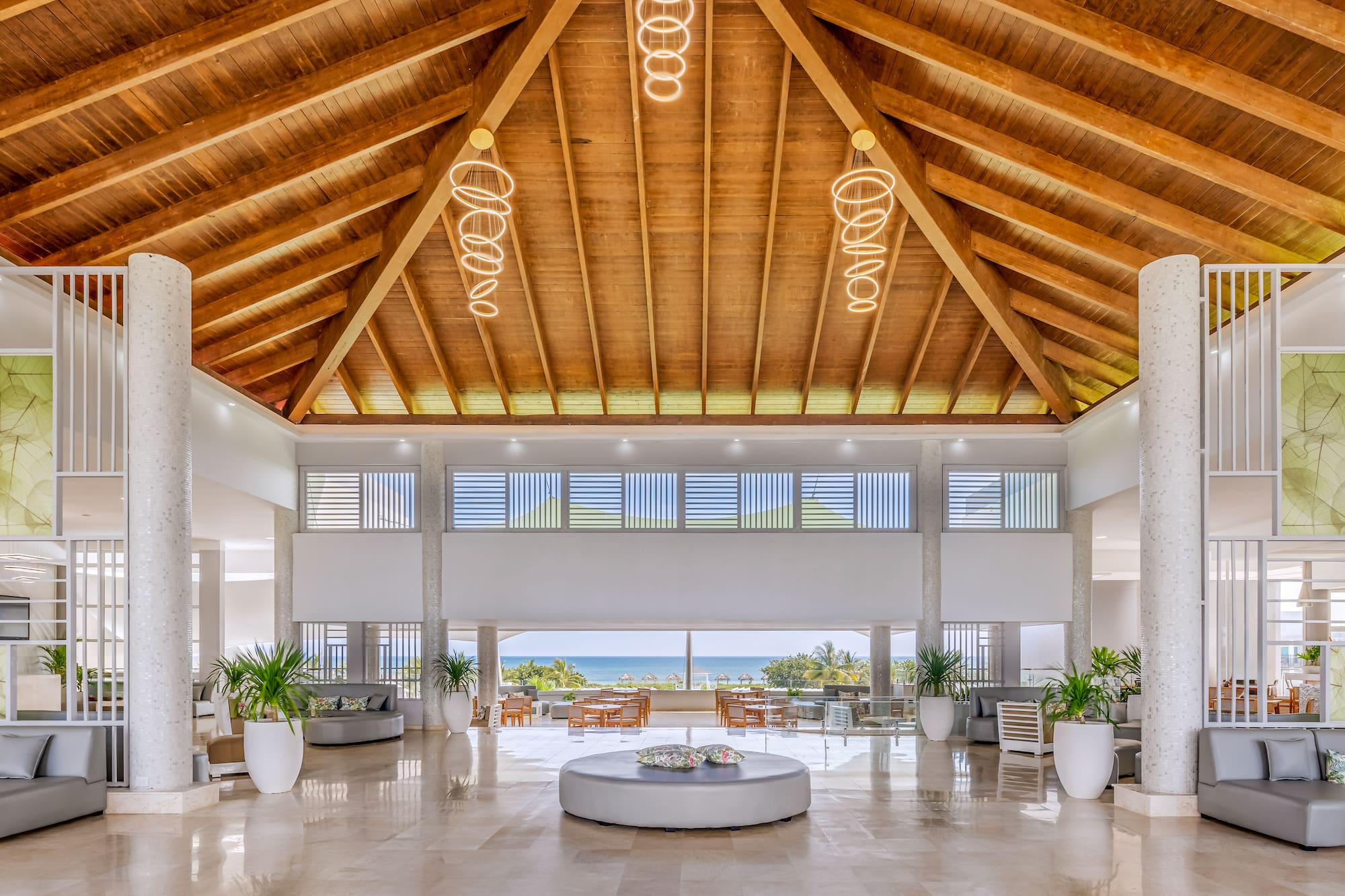 a large room with a large round table and chairs