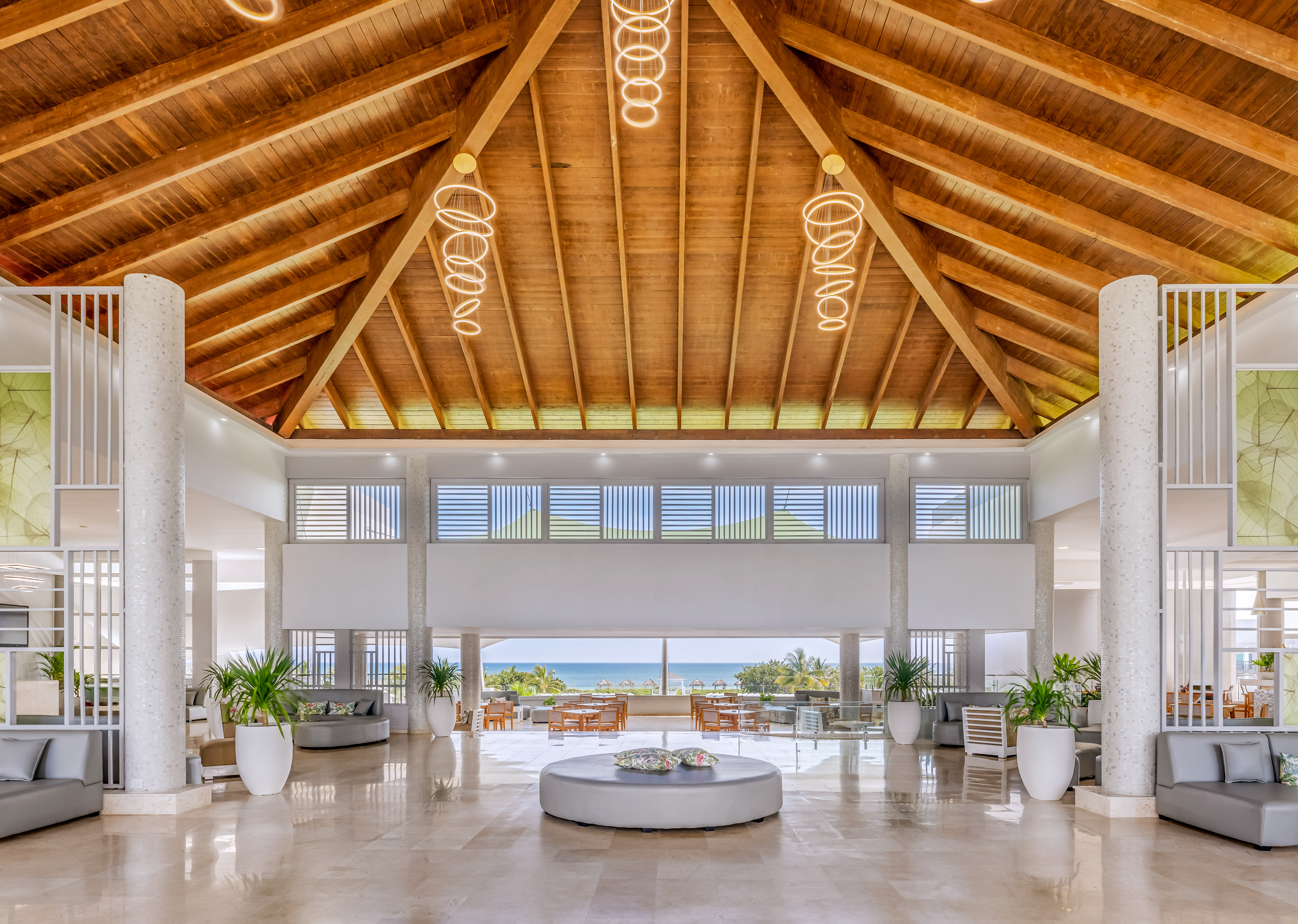 a large room with a large round table and chairs