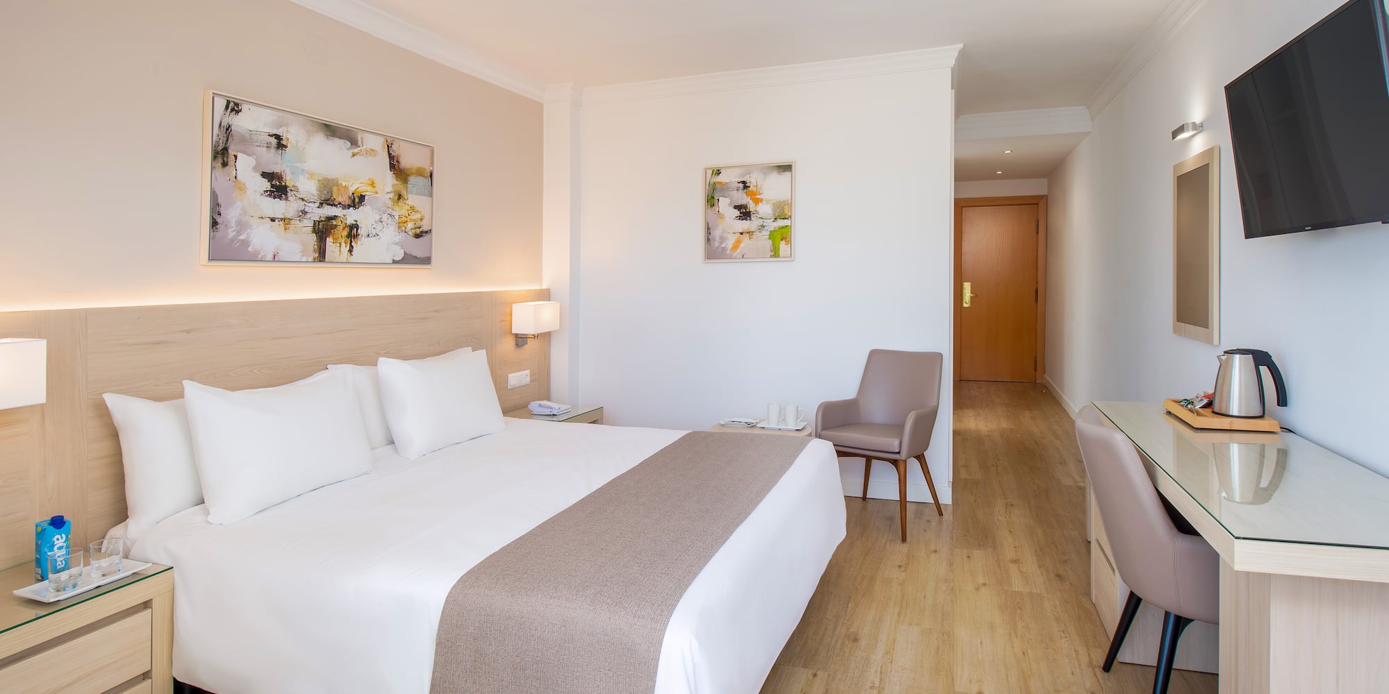 a bedroom with a bed and a chair