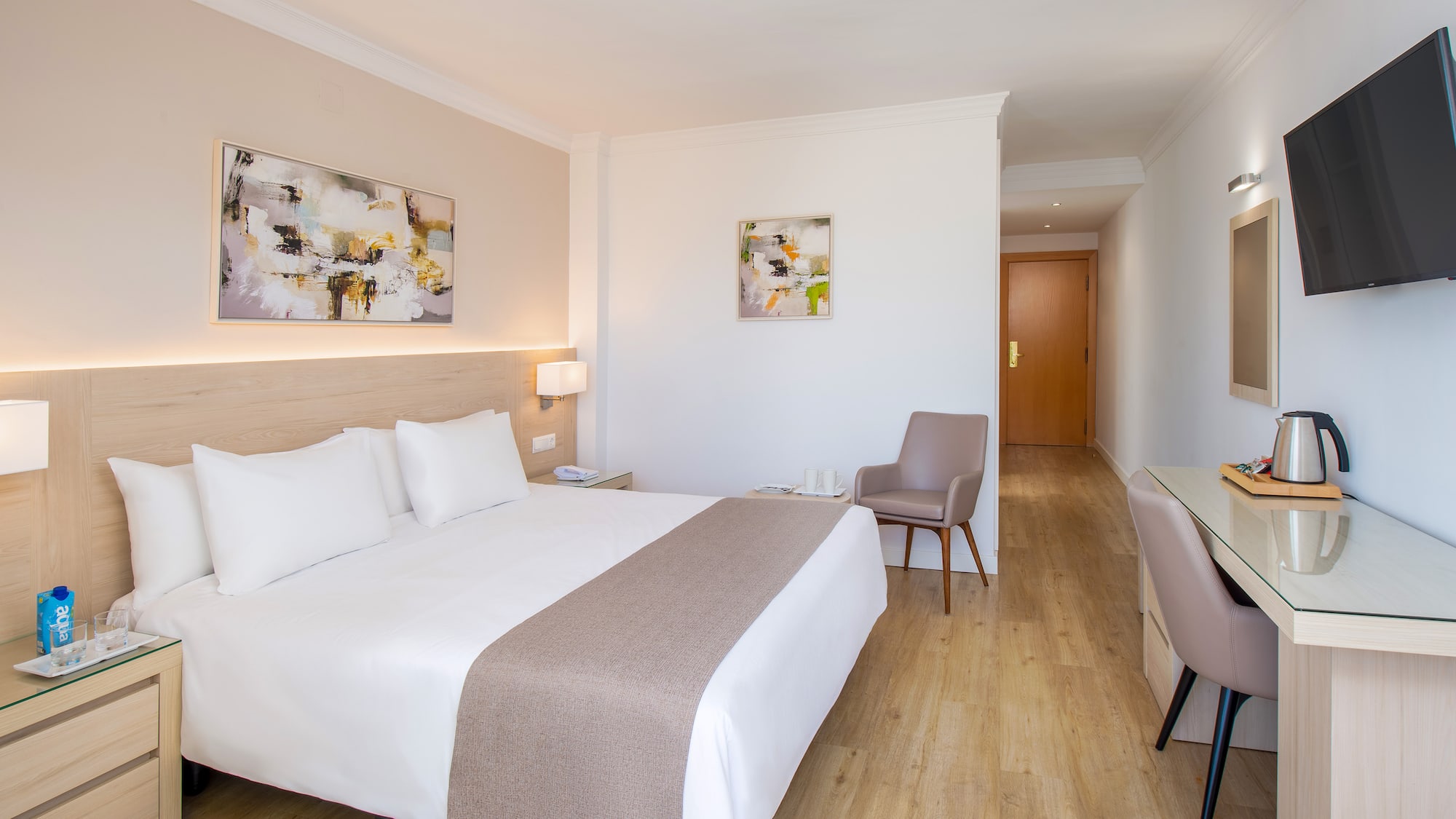 a bedroom with a bed and a chair