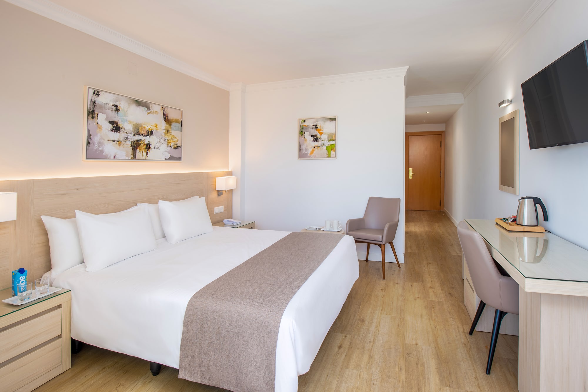 a bedroom with a bed and a chair