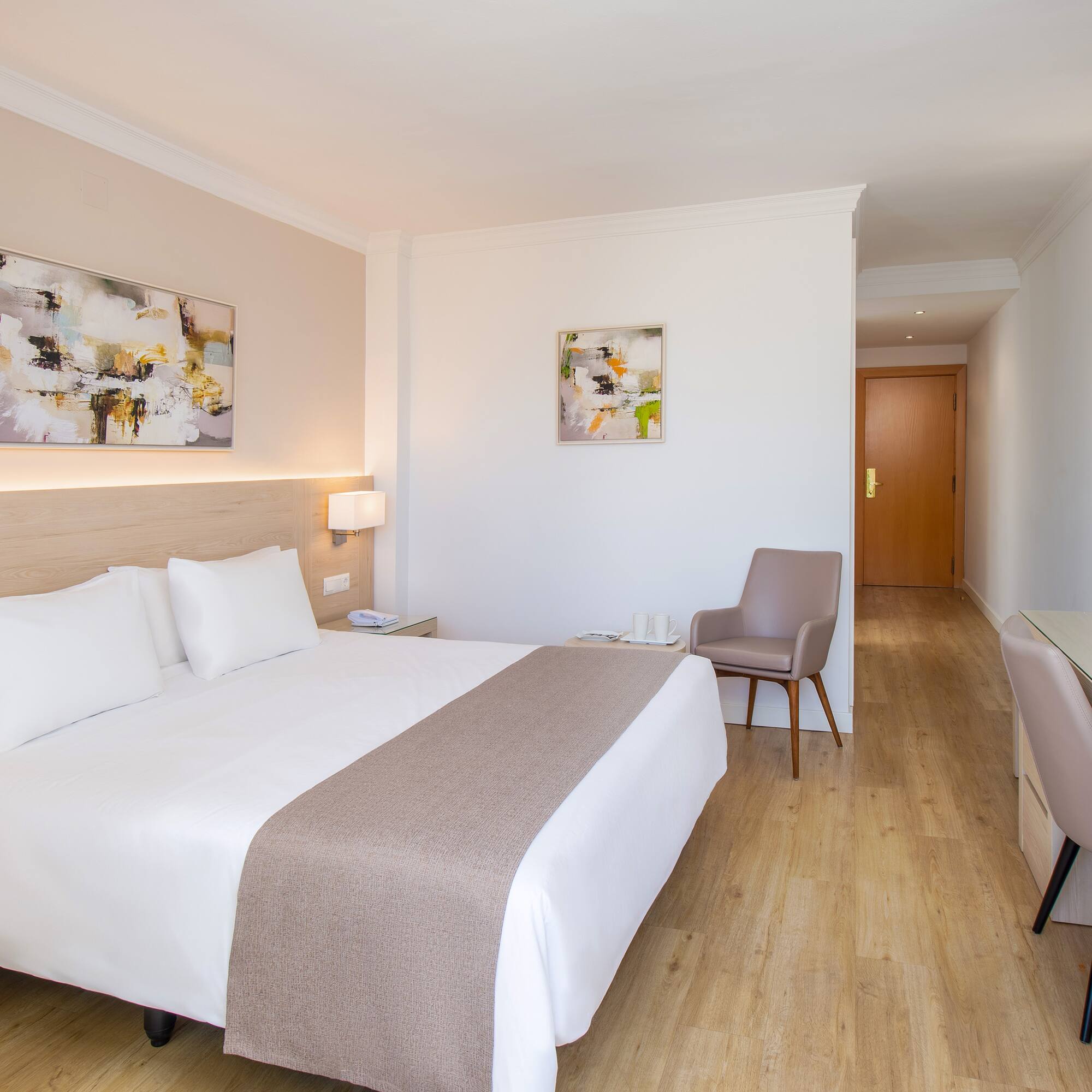 a bedroom with a bed and a chair