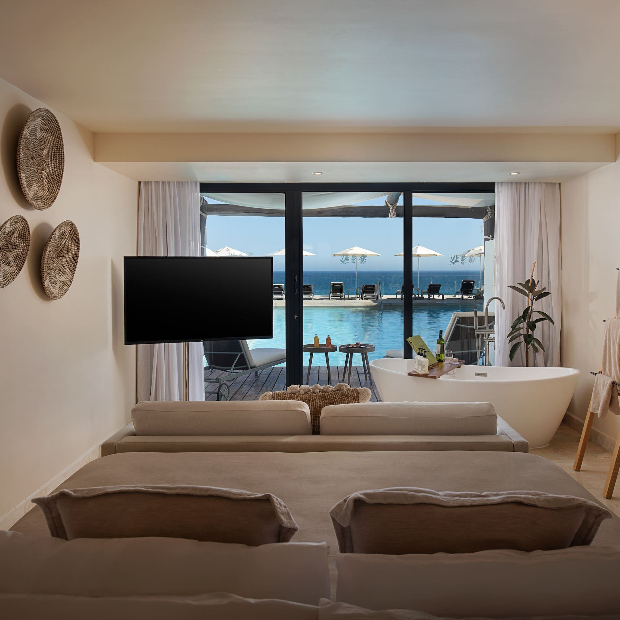 a room with a television and a tub