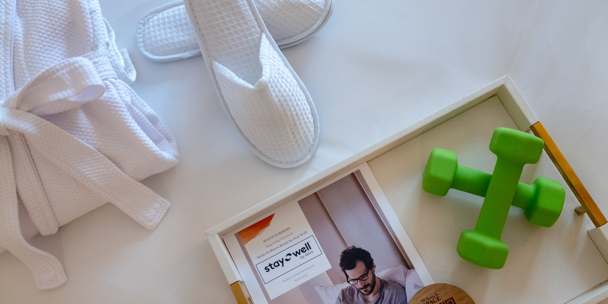 a pair of slippers and green dumbbells