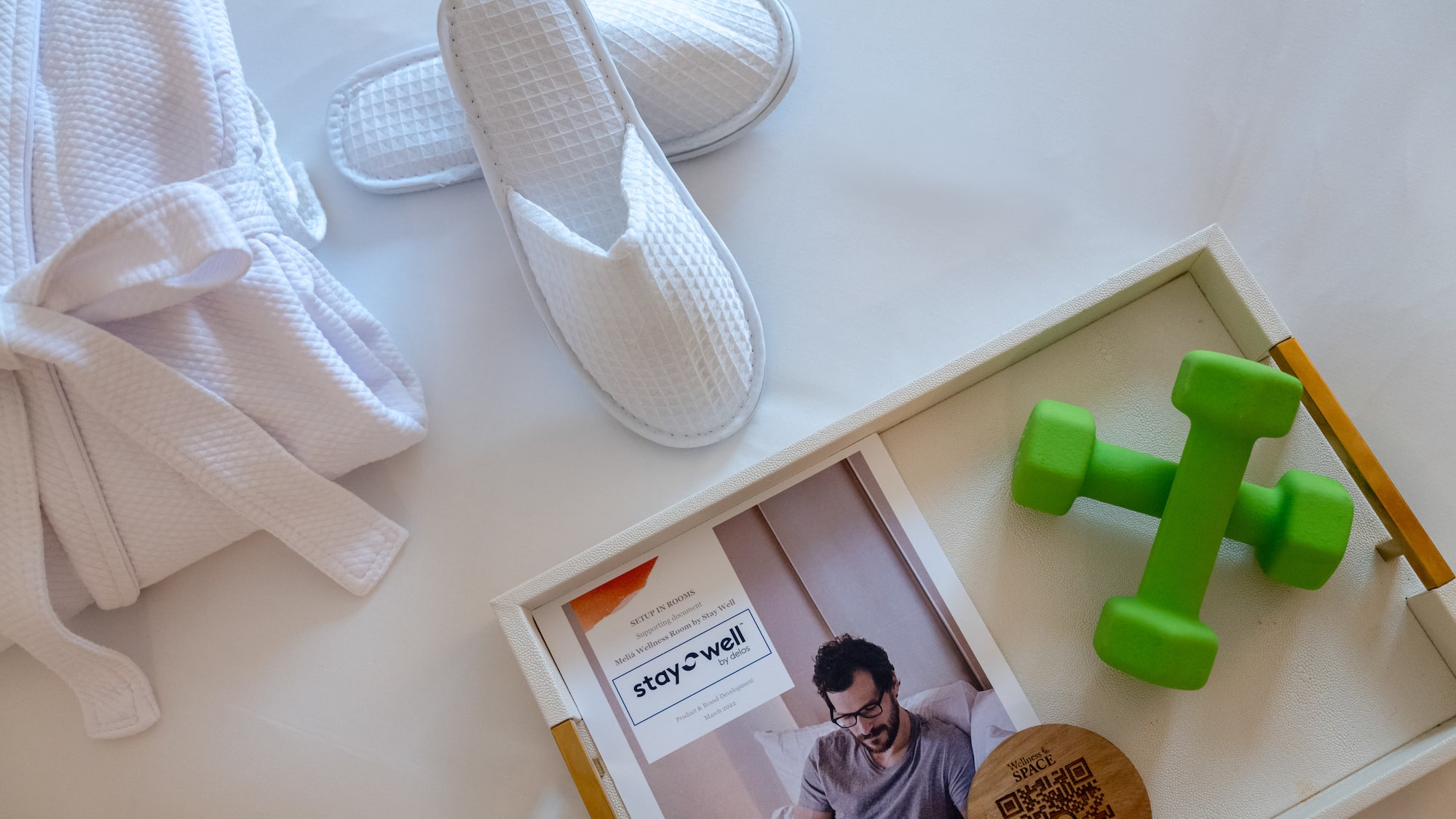 a pair of slippers and green dumbbells