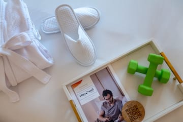 a pair of slippers and green dumbbells