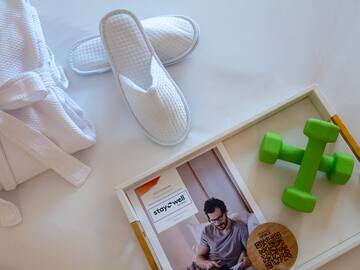 a pair of slippers and green dumbbells