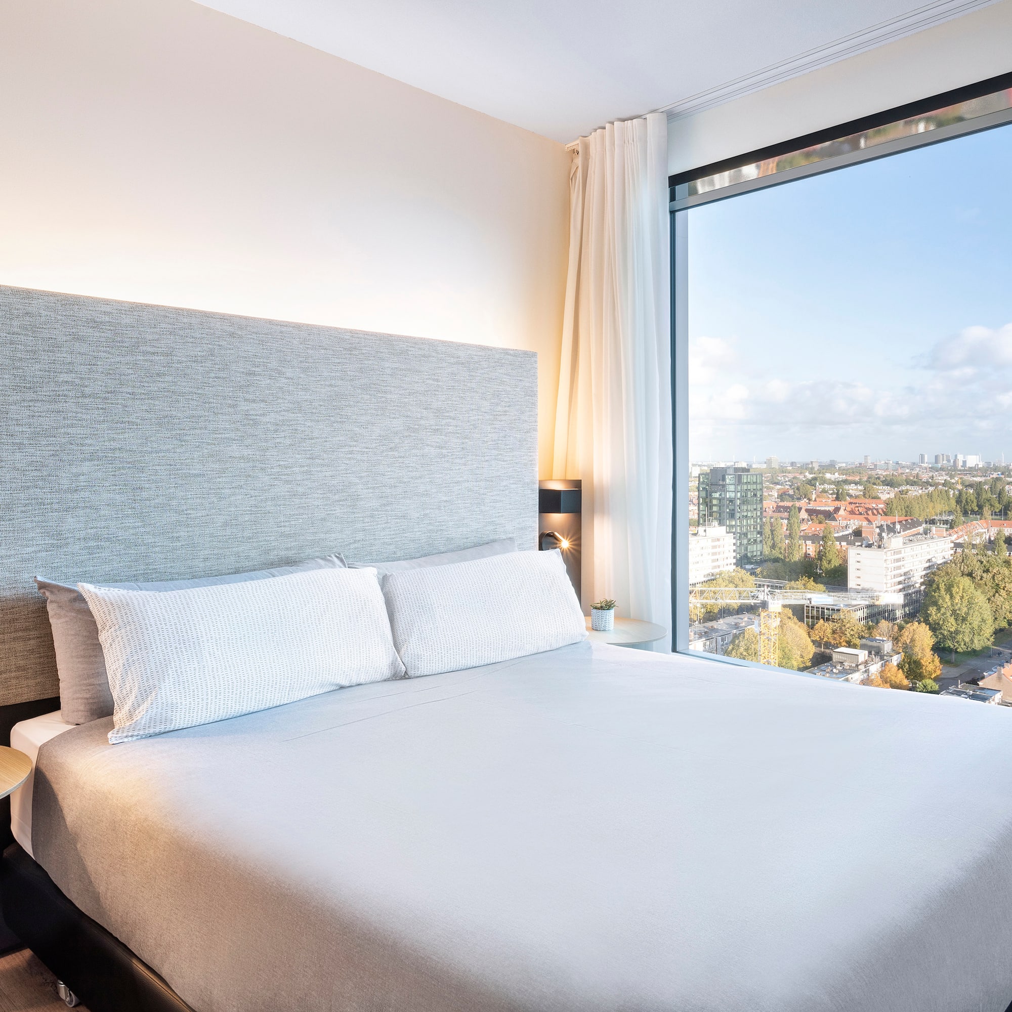 a bed with a large window