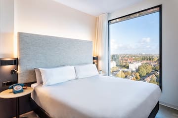 a bed with a large window