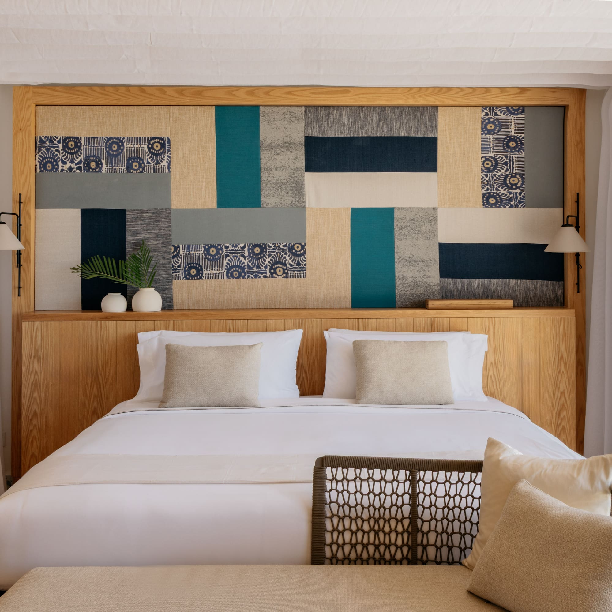 a bed with pillows and a headboard