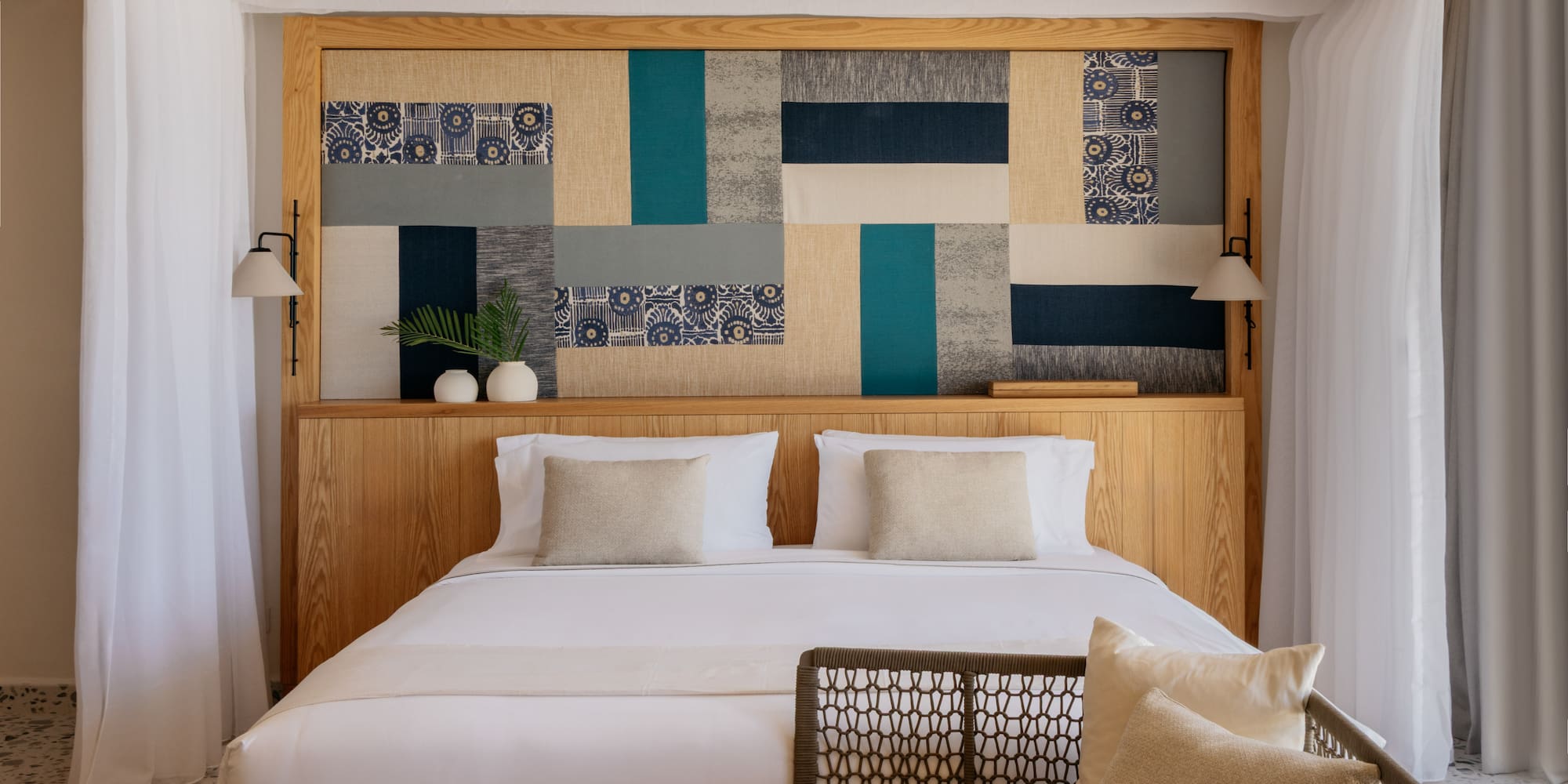 a bed with pillows and a headboard