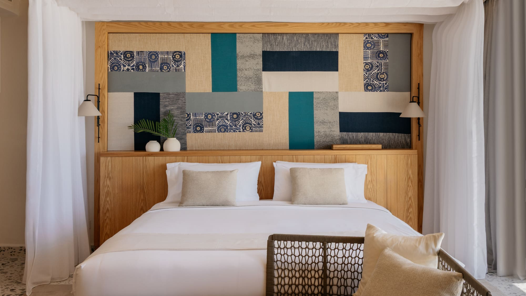 a bed with pillows and a headboard