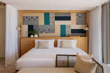 a bed with pillows and a headboard