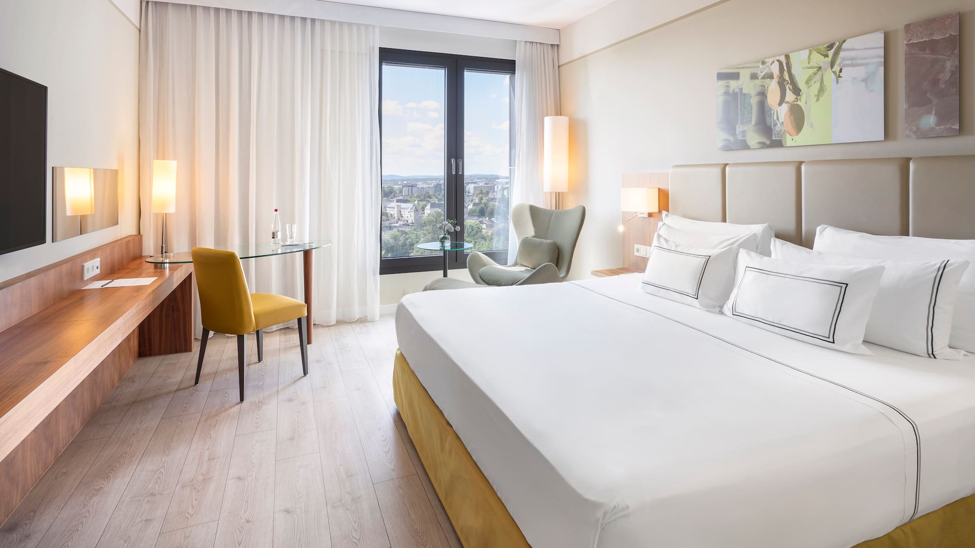 a room with a bed and a desk and chair