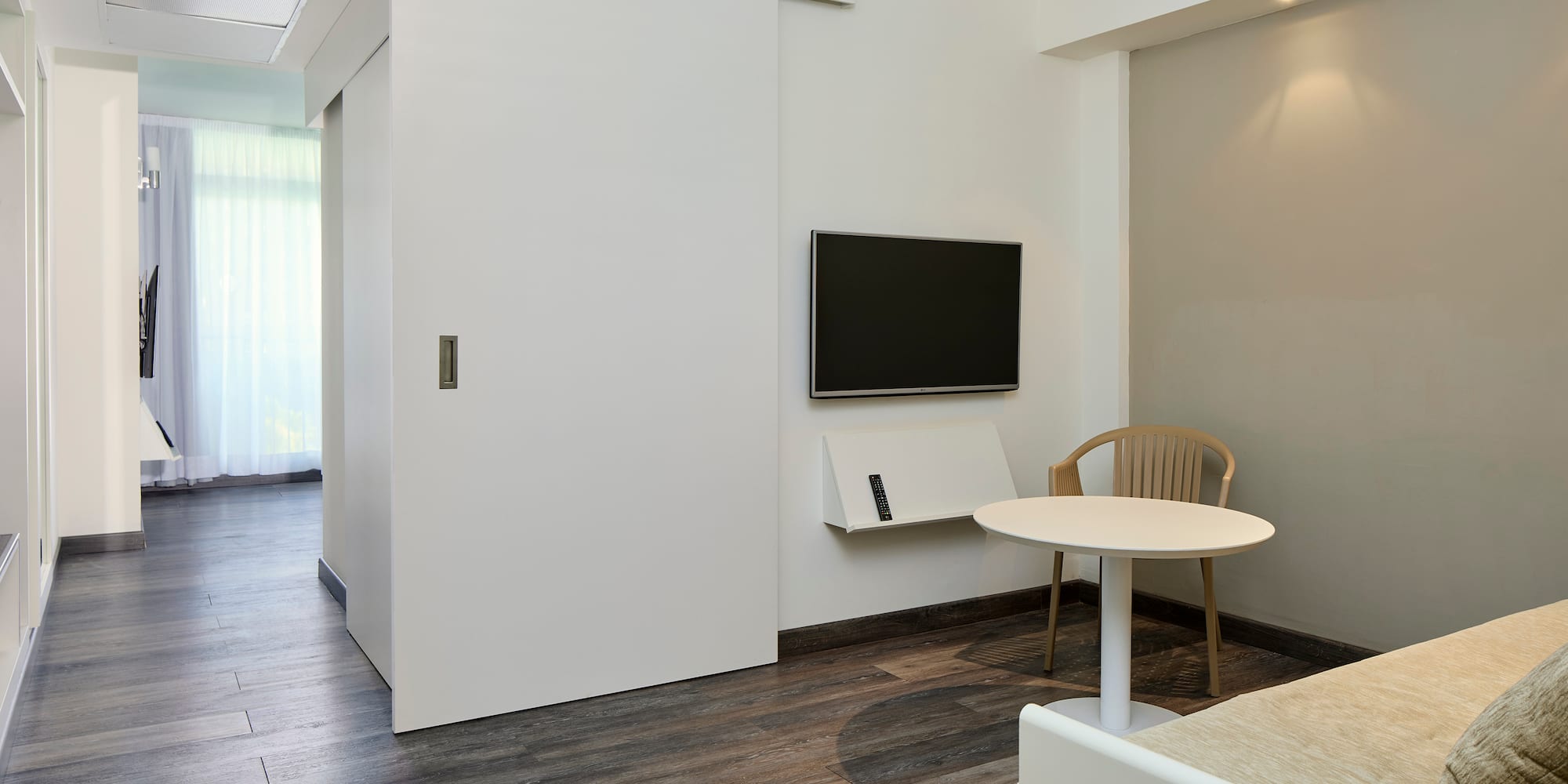 a room with a table and a tv