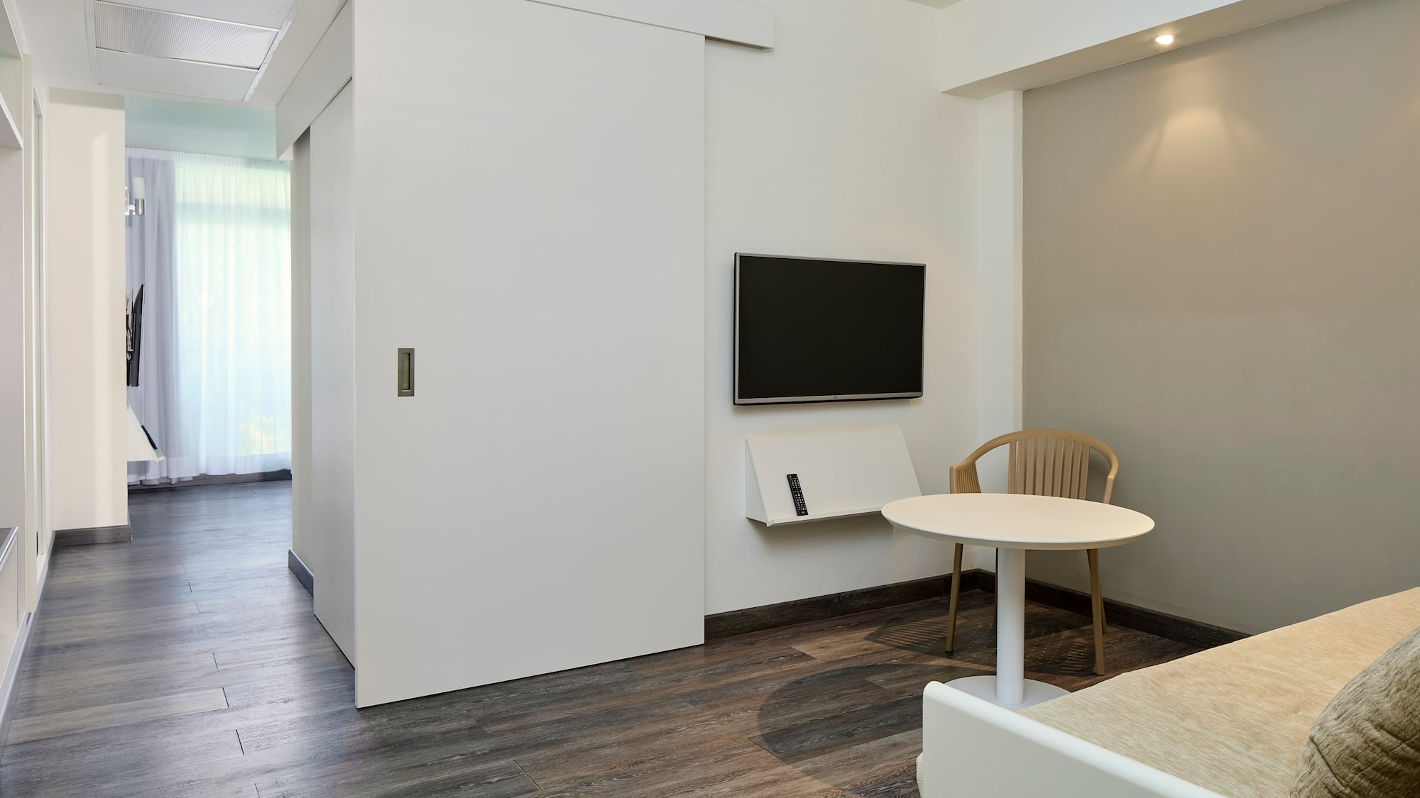 a room with a table and a tv