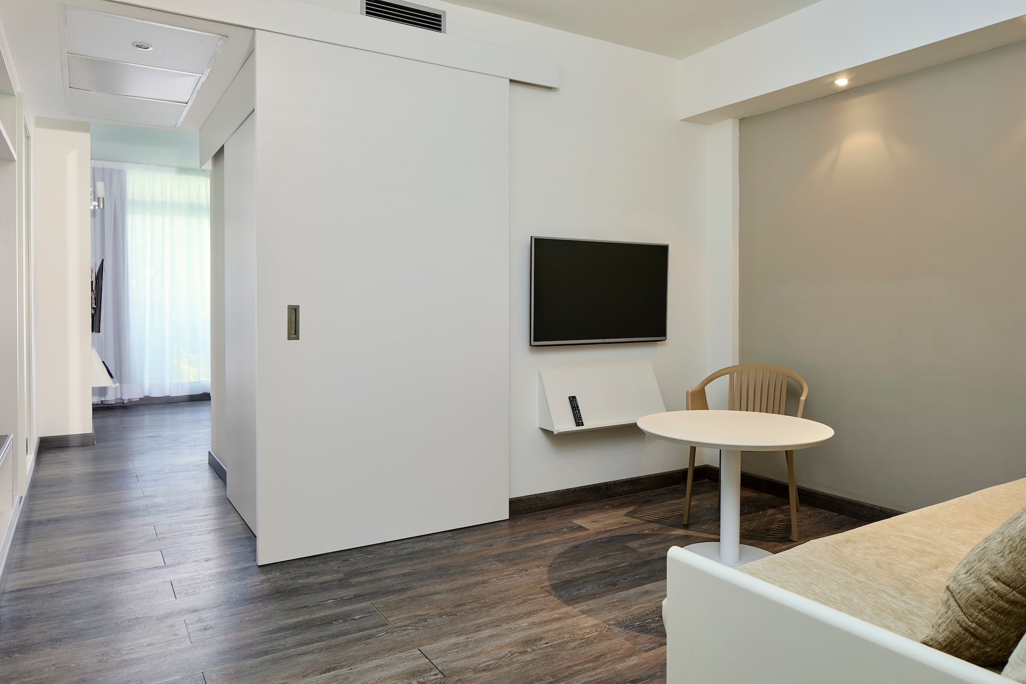 a room with a table and a tv