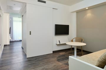 a room with a table and a tv