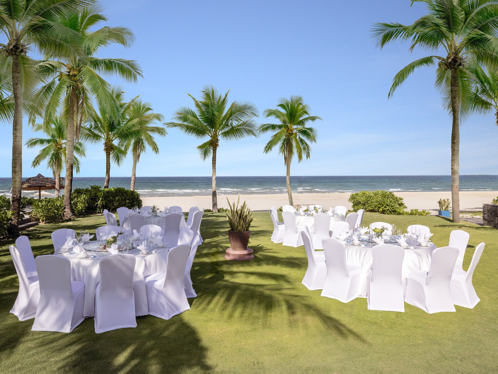 a group of tables set up on a beach