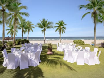 a group of tables set up on a beach