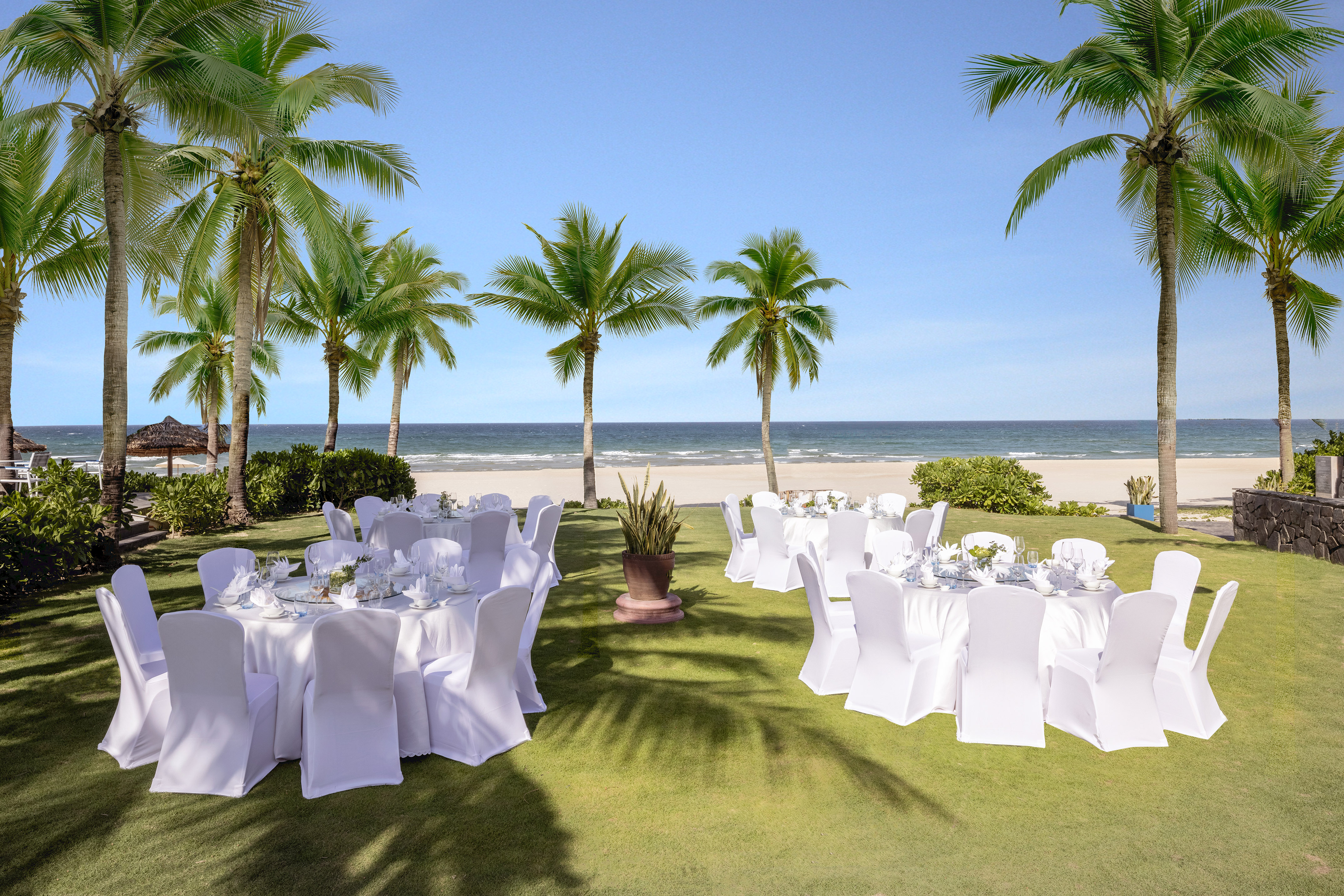 a group of tables set up on a beach