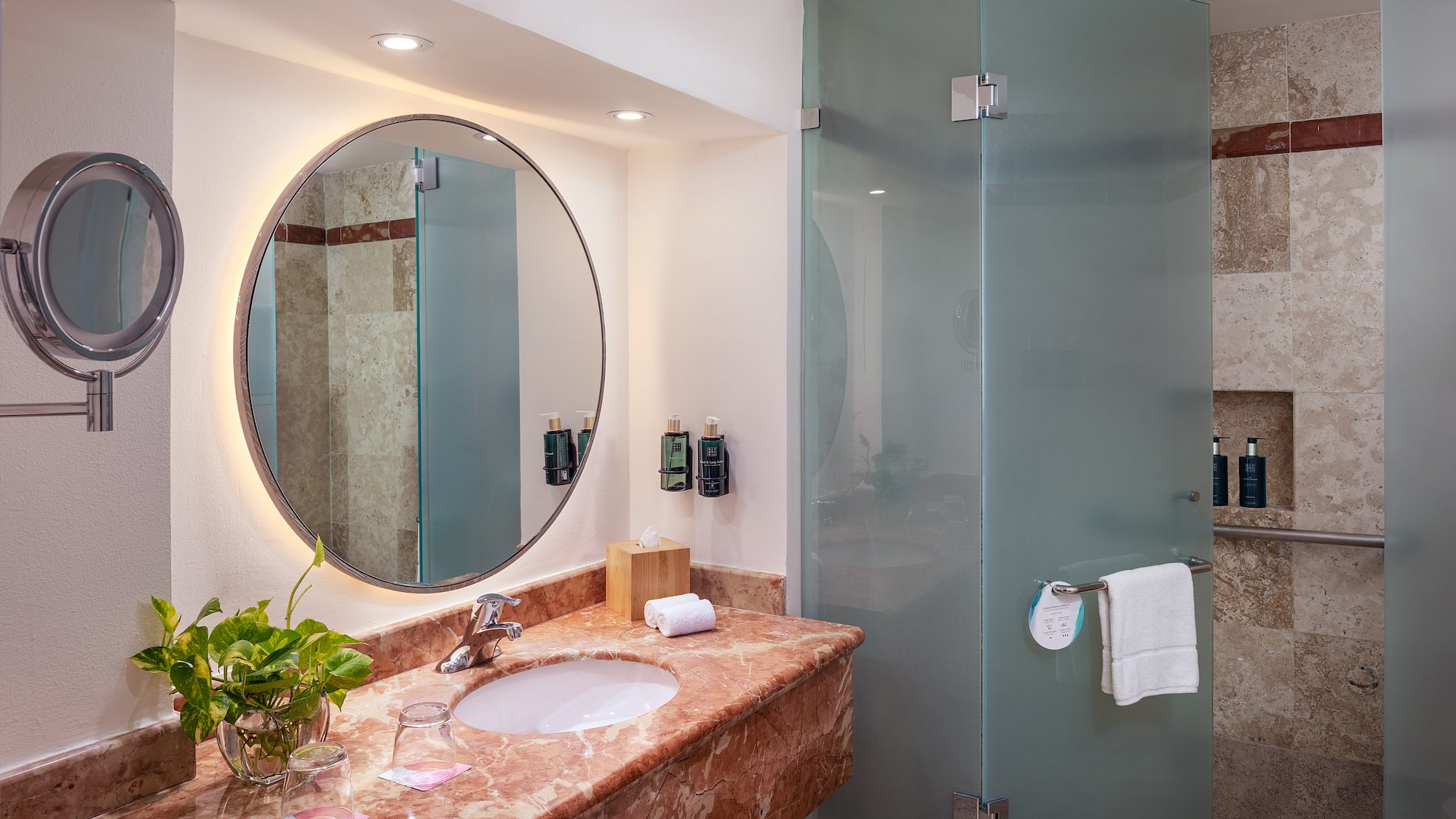 a bathroom with a mirror and a shower