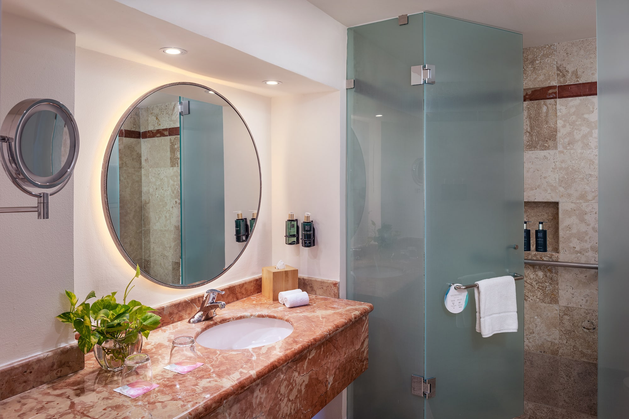 a bathroom with a mirror and a shower