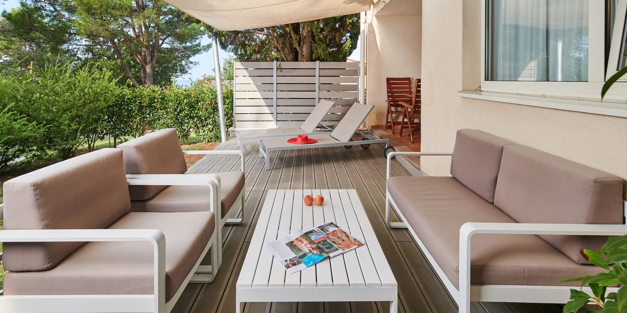 a patio with a table and chairs