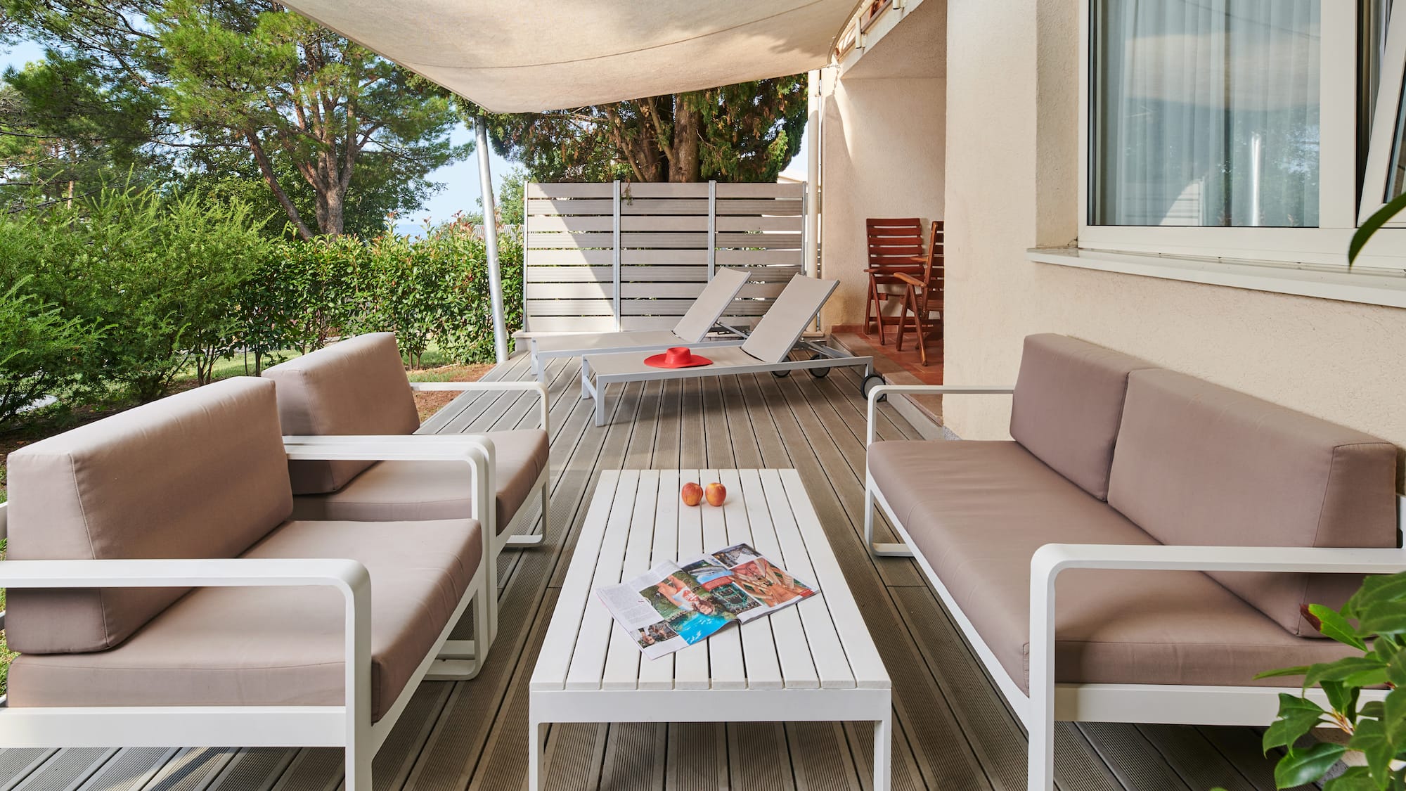 a patio with a table and chairs