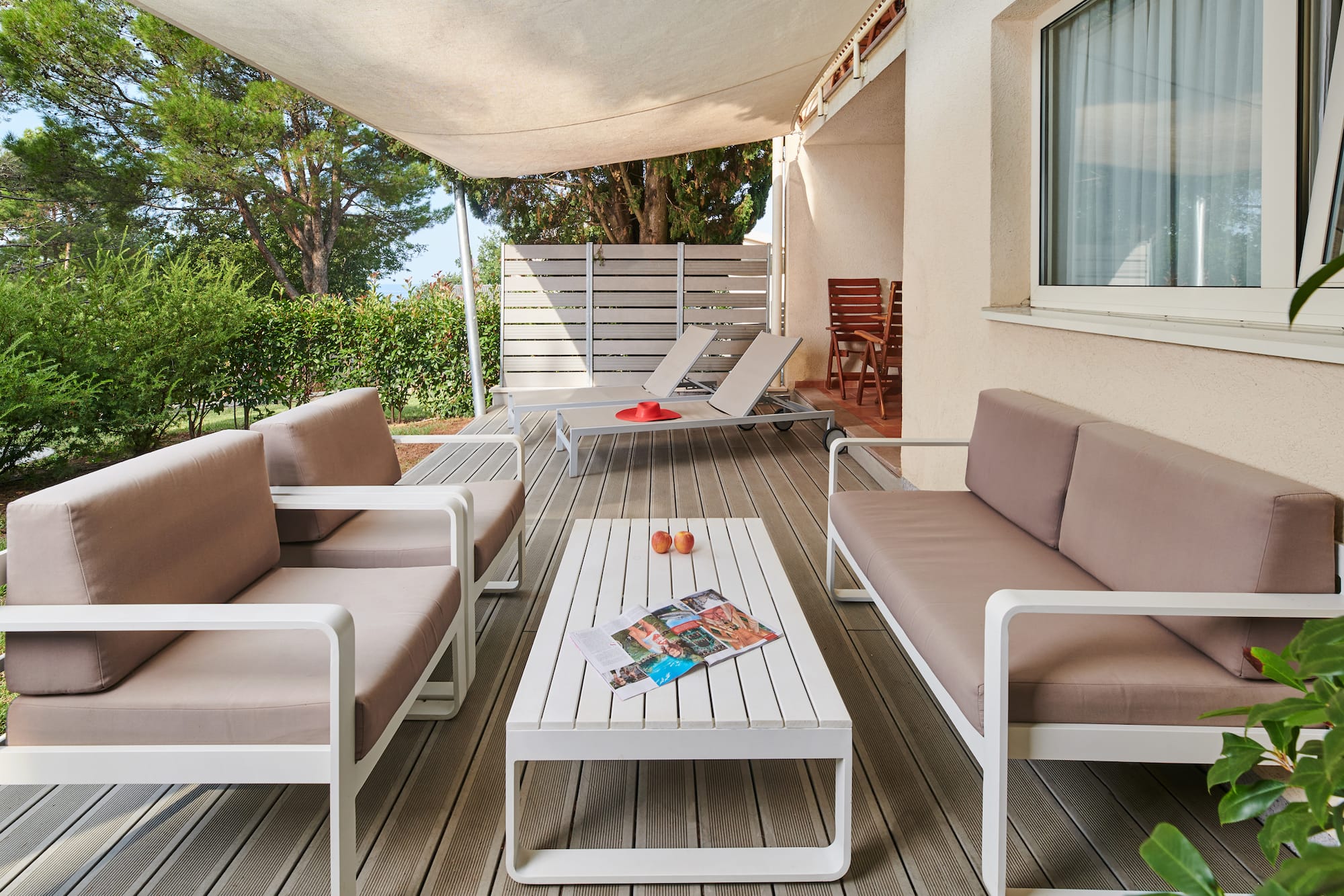 a patio with a table and chairs