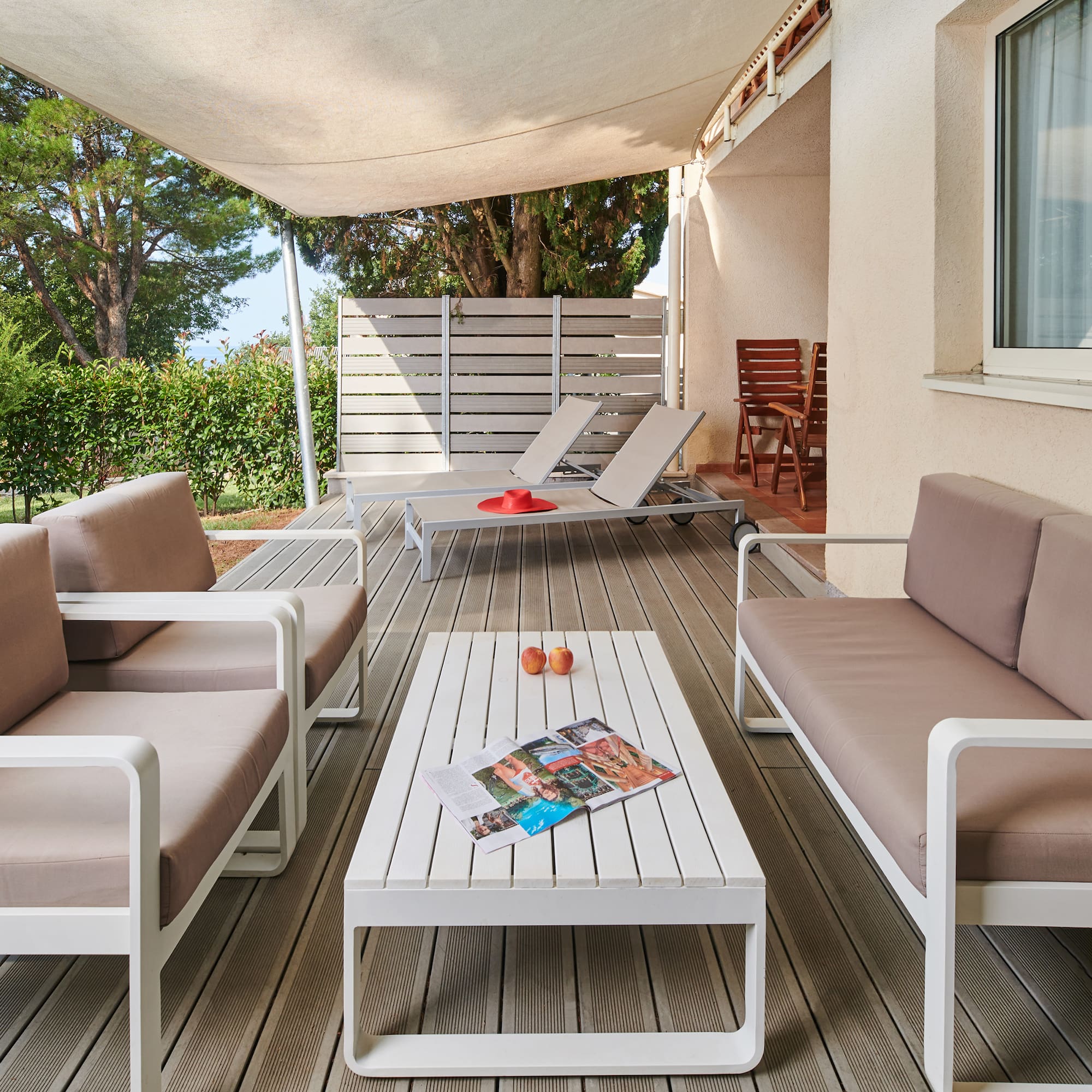 a patio with a table and chairs