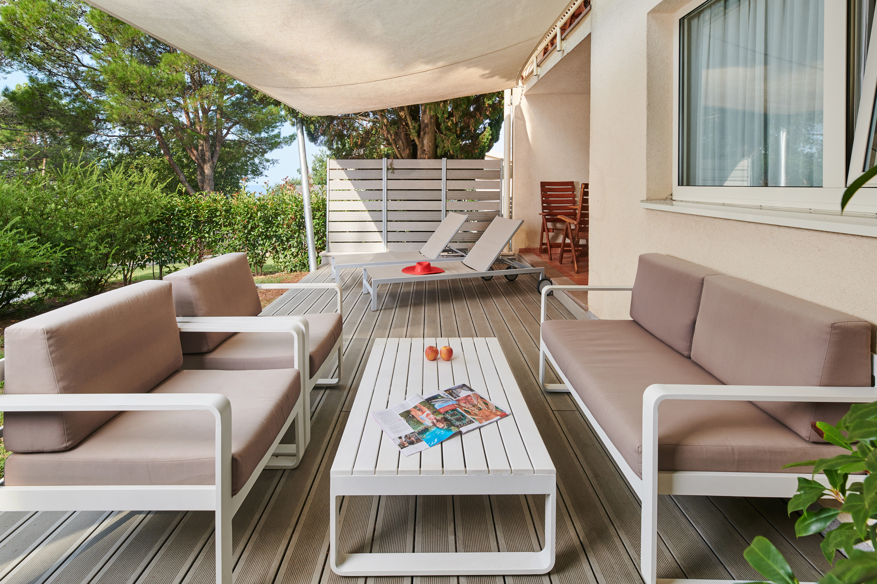 a patio with a table and chairs