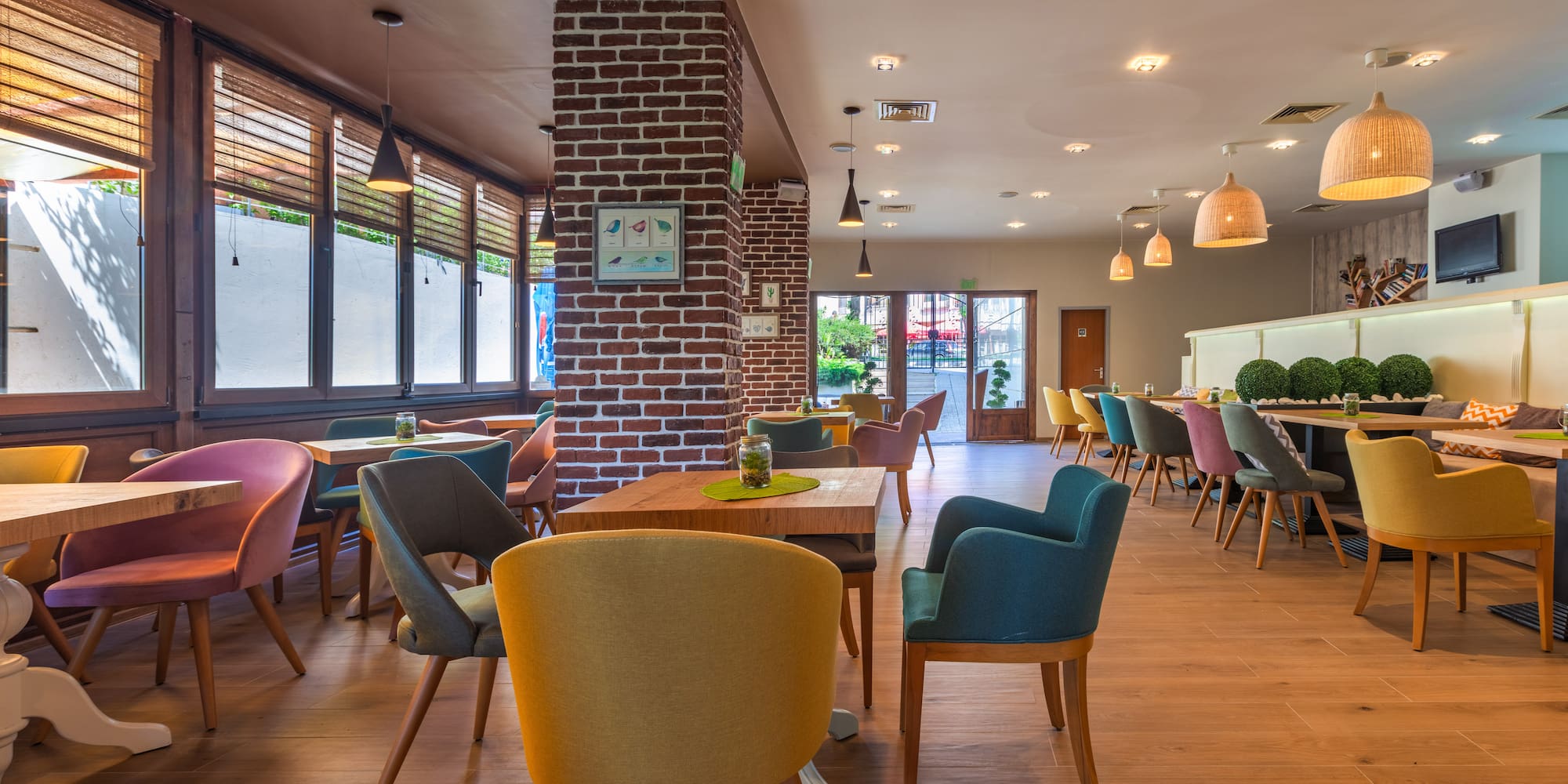 a room with a brick wall and chairs