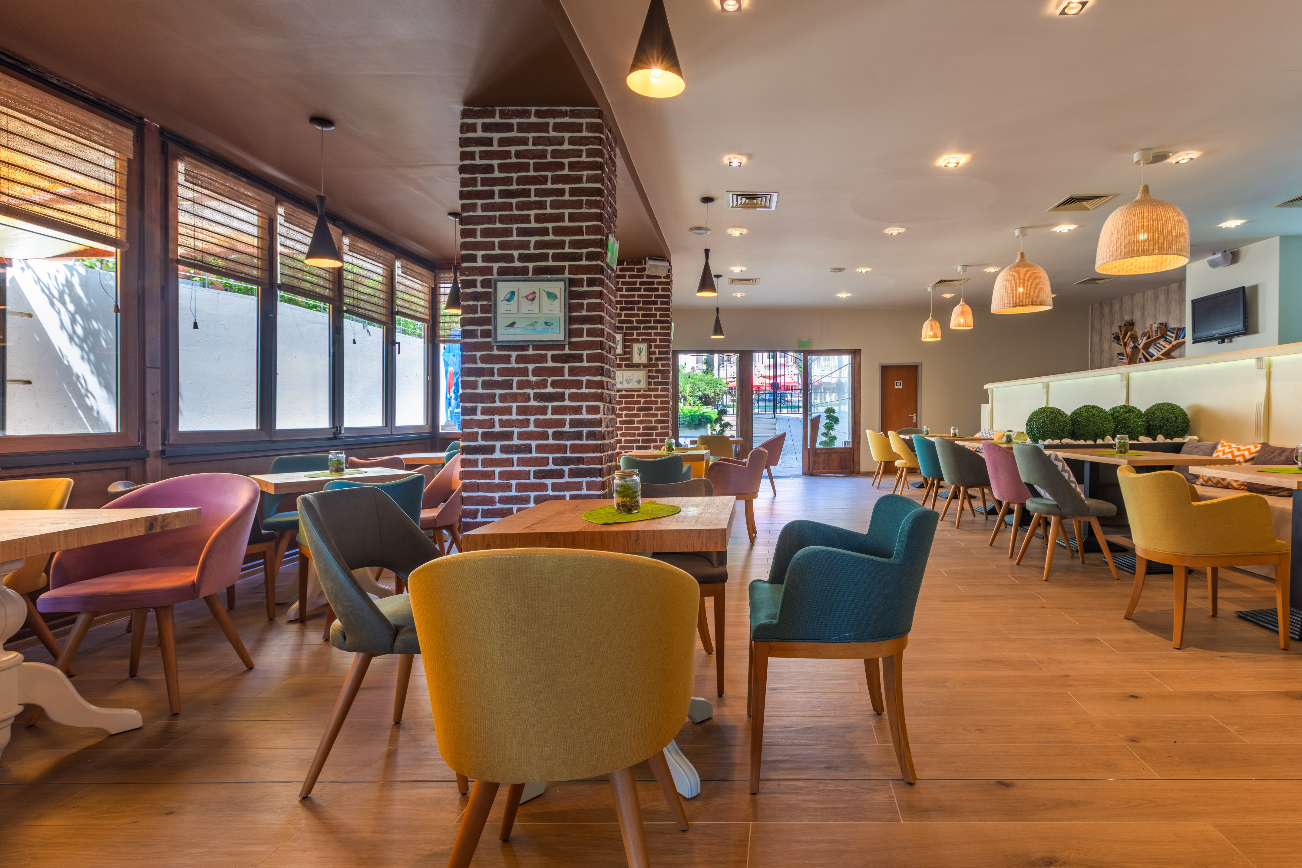 a room with a brick wall and chairs