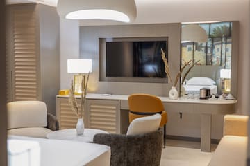 a room with a television and a bed