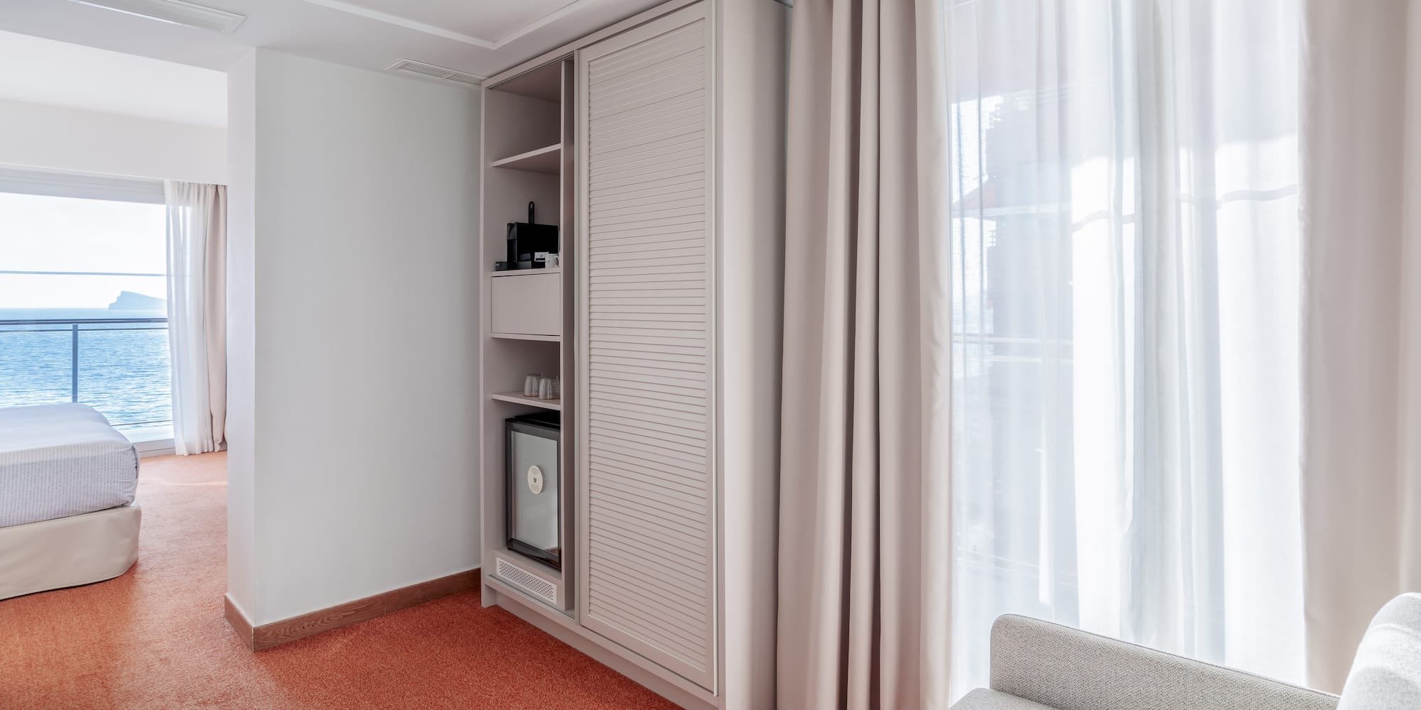 a room with a couch and a cabinet