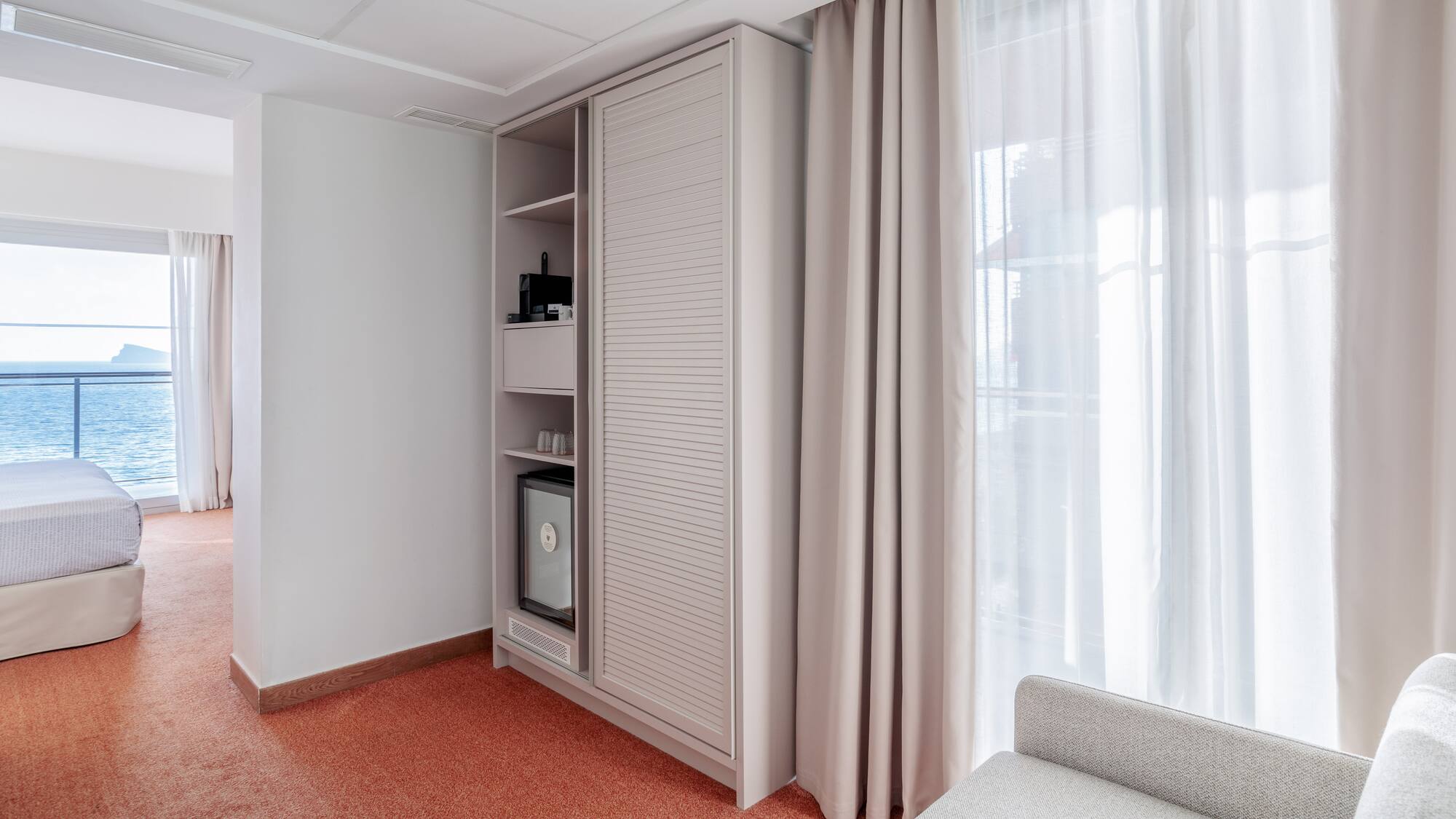 a room with a couch and a cabinet