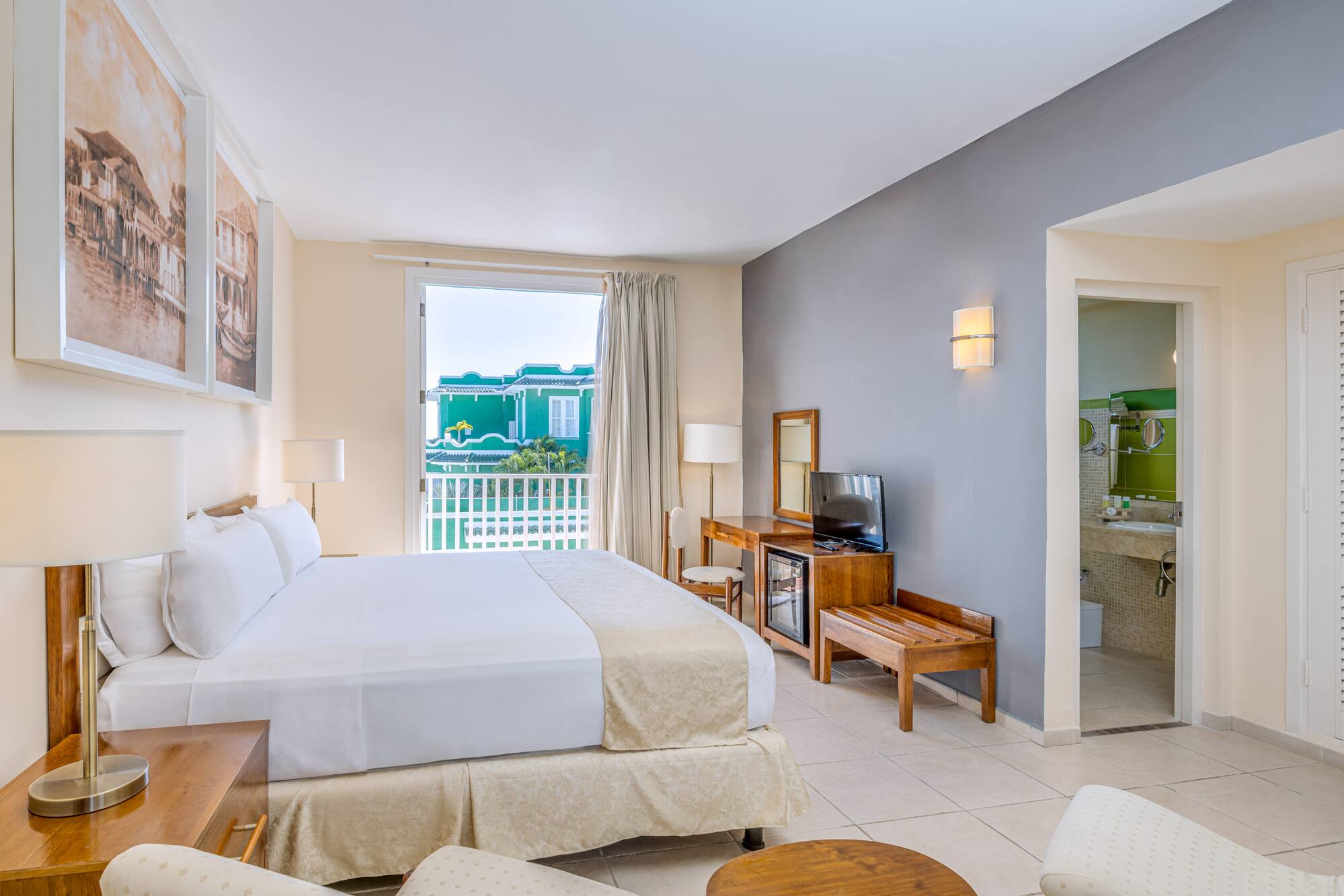 a room with a bed and a television