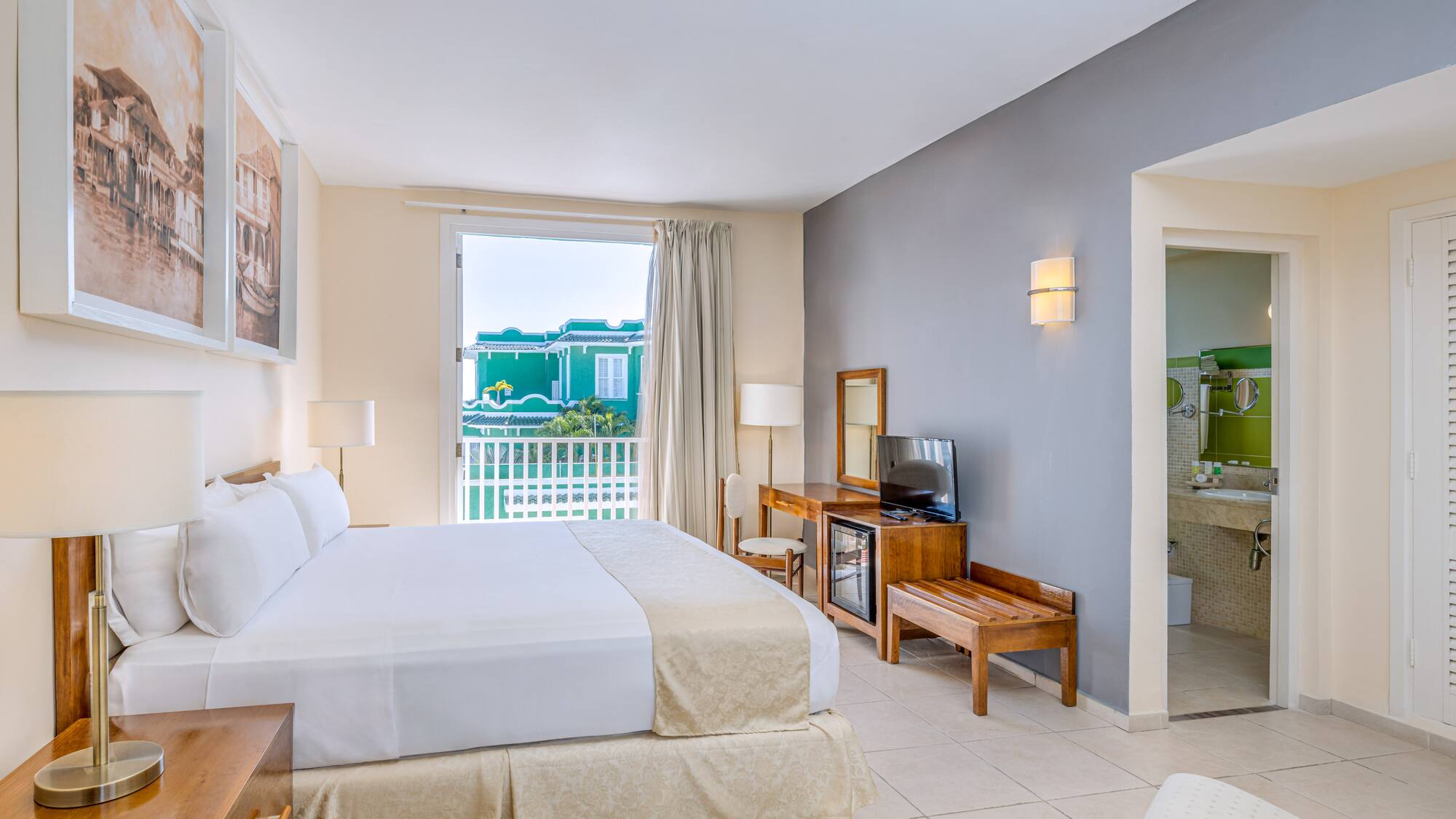 a room with a bed and a television