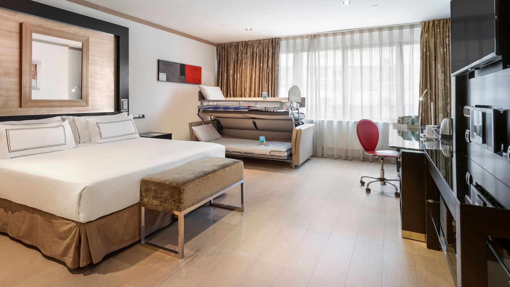 a room with a bed and a desk