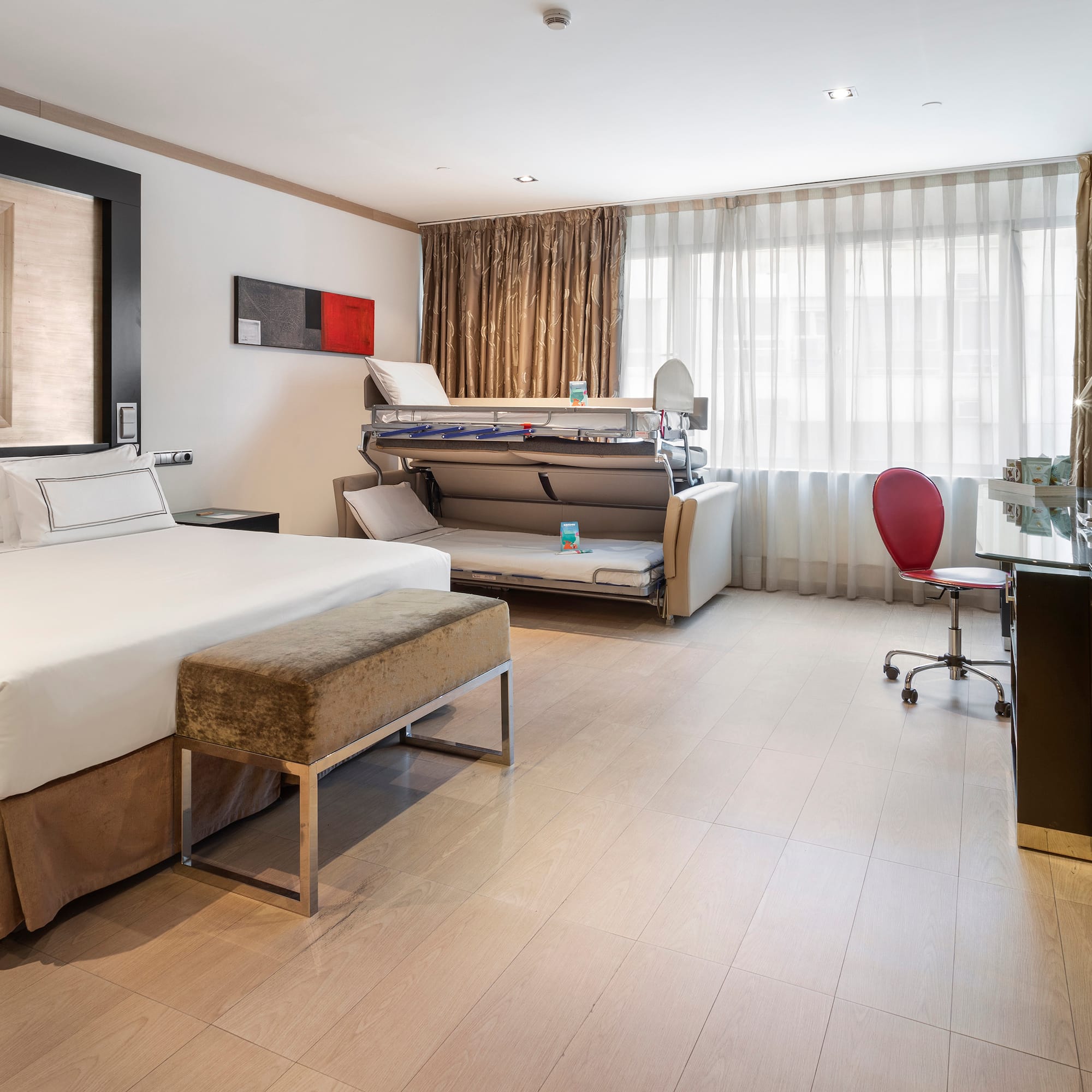 a room with a bed and a desk