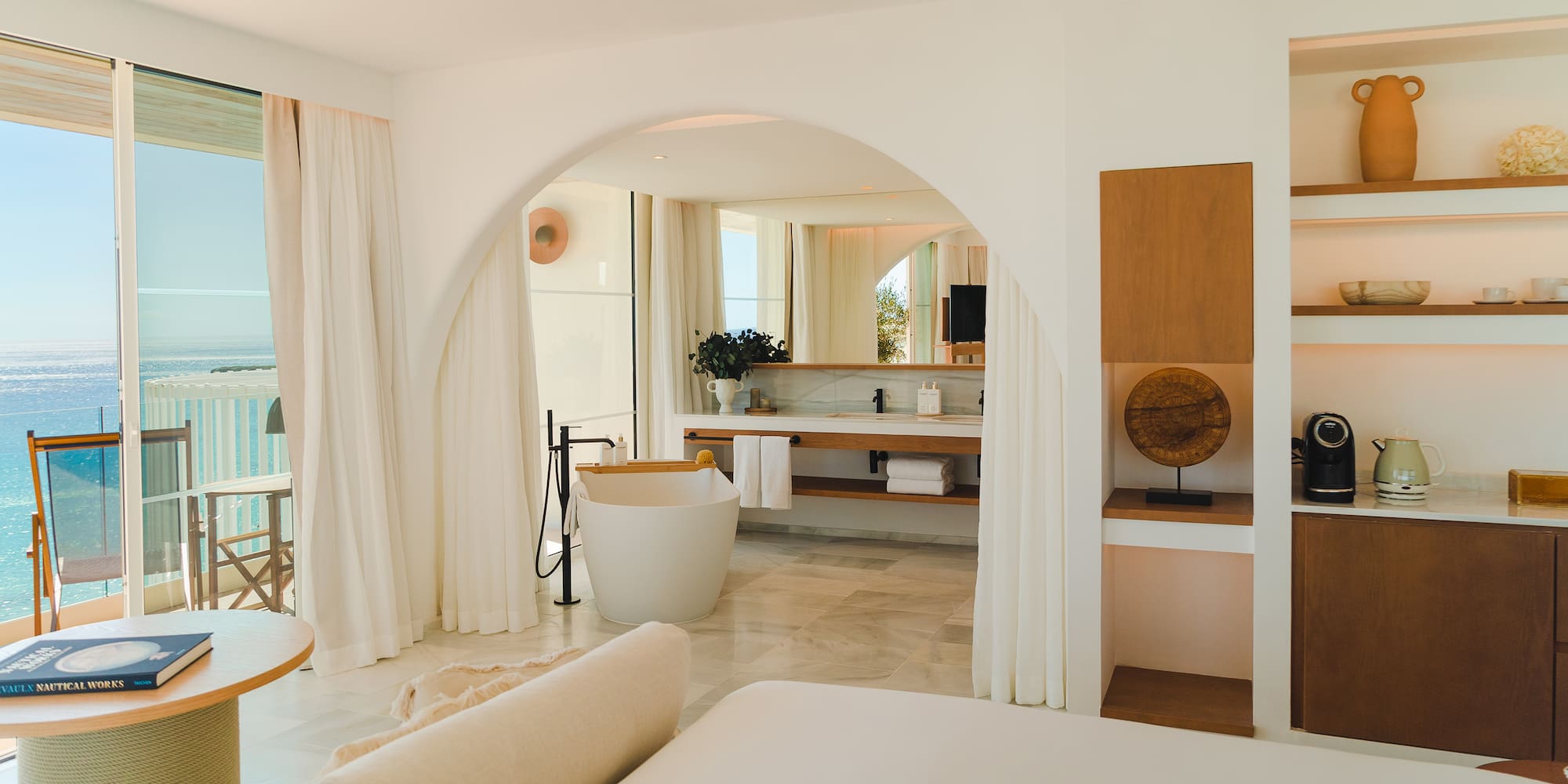 a bathroom with a tub and a bathtub