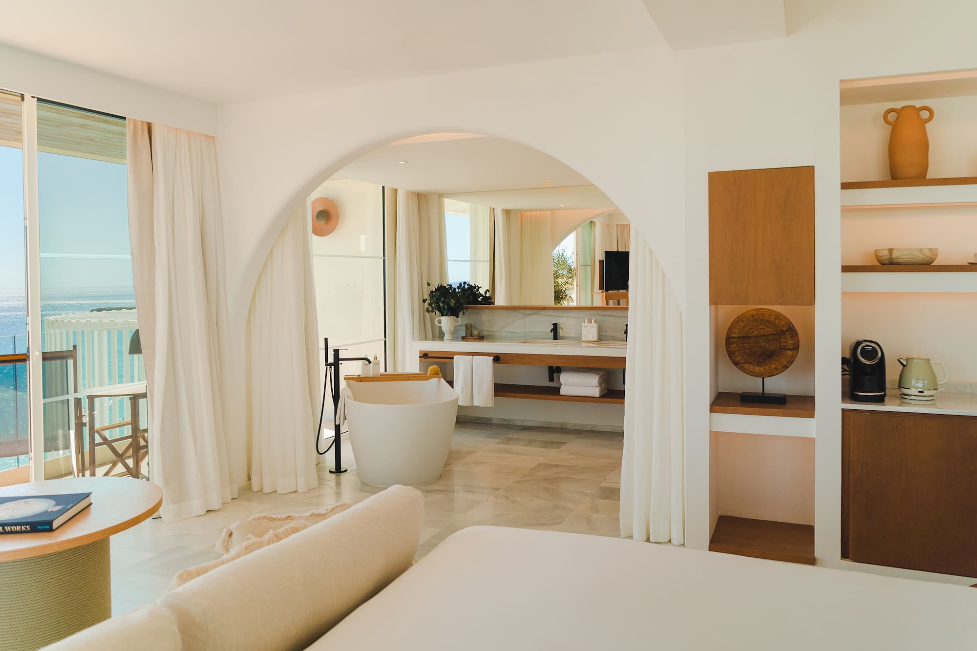 a bathroom with a tub and a bathtub